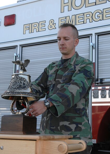 Tech. Sgt. Michael Munson, NCOIC Training and Readiness, 49th Civil Engineers Squadron, rings the Ceremonial Bell during the Last Alarm Bell Ceremony honoring Chief Master Sergeant retired Hugh Pike  April 10 at Holloman Air Force Base. Mr. Pike, whose career spanned more than 40 years of military and civilian service, passed away on April 5 (U.S. Air Force photo by Airman 1st Class Jamal Sutter)