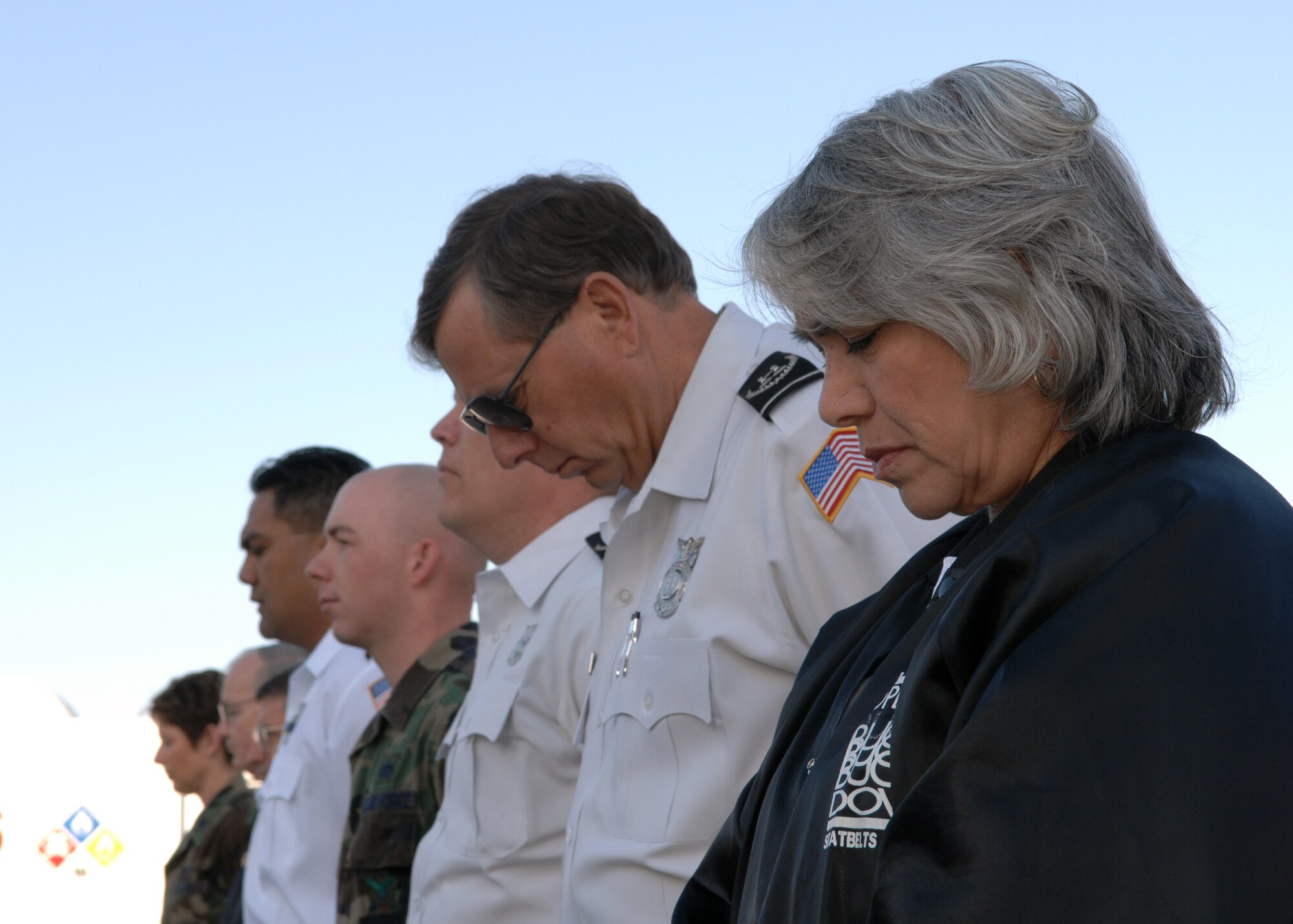 A moment of silence was taken to pay respects to Chief Master Sergeant retired Hugh Pike during a Last Alarm Bell Ceremony April 10, at Holloman Air Force Base. Chief Pike, whose career spanned more than 40 years of military and civilian service, passed away on April 5. (U.S. Air Force photo by Airman 1st Class Jamal Sutter)