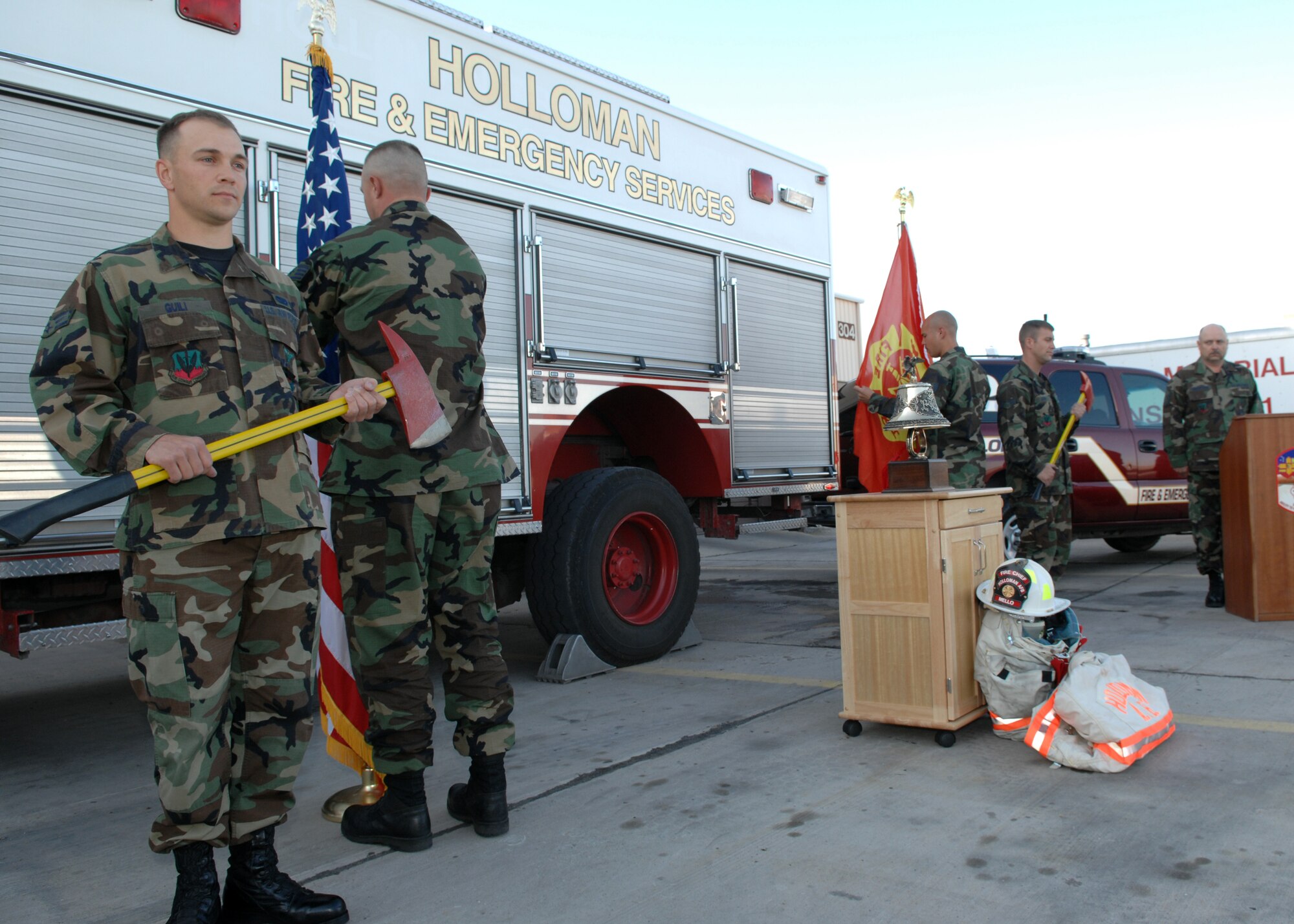 Senior Airman Lucas Guili, Staff Sergeant Chad Schumpert, Staff Sergeant Jonathan Peaden, and Senior Airman Christopher Dunn, 49th Civil Engineering Squadron Fire Protection Color Guard, post Colors during the Last Alarm Bell Ceremony honoring retired Chief Master Sgt Hugh Pike April 10, at Holloman Air Force Base. All Air Force Fire Emergency Services Flights honor their fallen firefighters by following the Air Force Fallen Firefighters protocol. Chief Pike passed away April 5. (U.S. Air Force photo by Airman 1st Class Jamal Sutter)