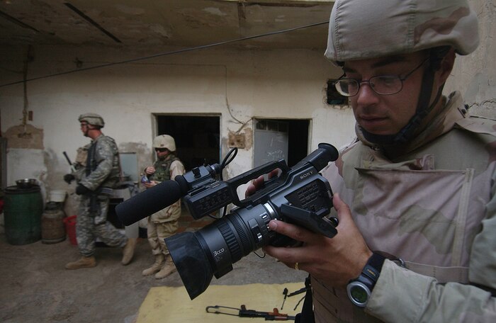 Tech. Sgt. Gary Burdett, 1st Combat Camera Squadron videographer, records a video while deployed to Iraq.  Sergeant Burdett was selected as the best videographer in DOD for 2006. (U.S. Air Force photo/ Tech. Sgt. Adrian Cadiz)