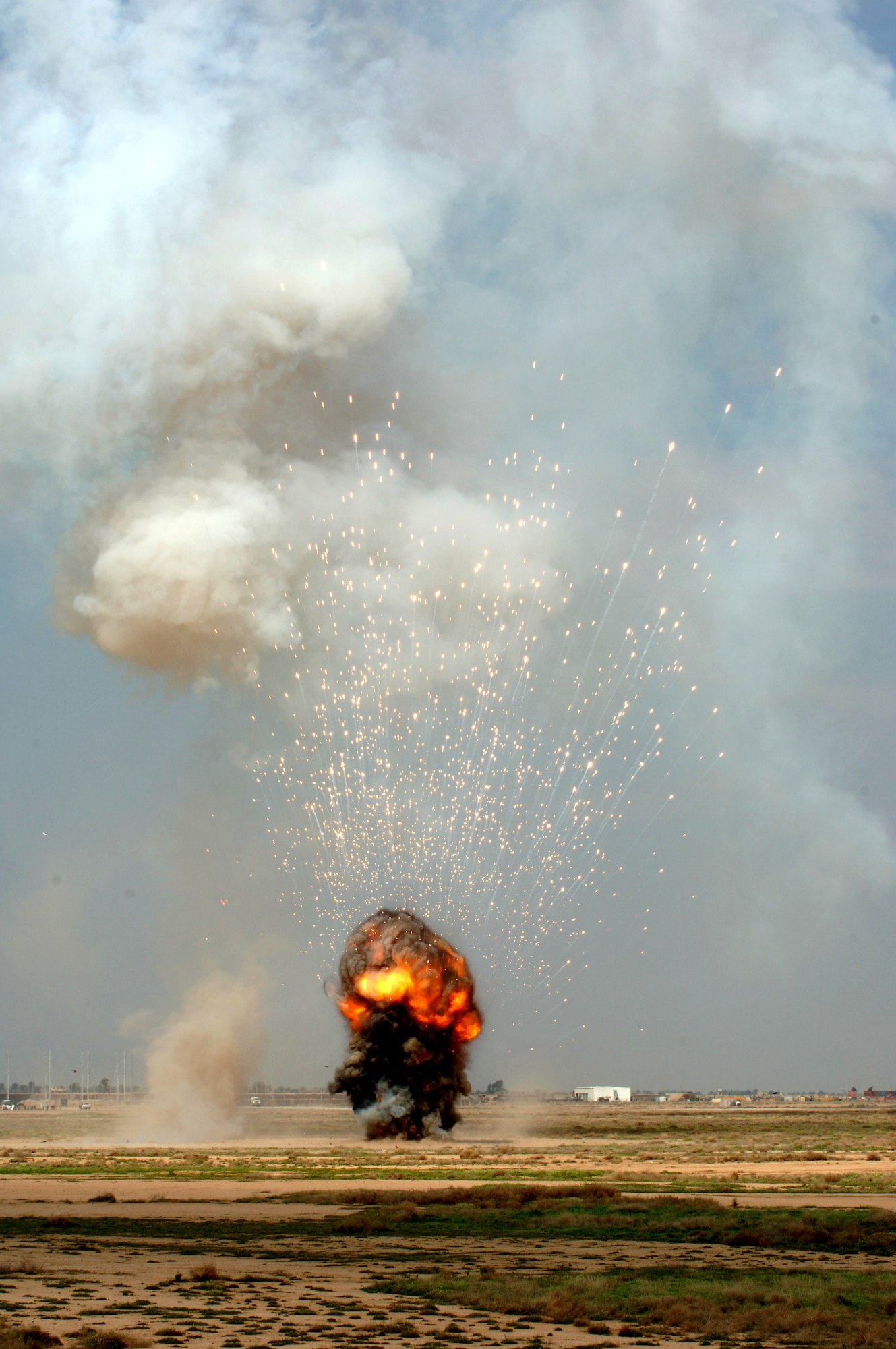A controlled detonation is conducted by Airmen with the 332nd Expeditionary Civil Engineer Squadron's Explosive Ordnance Disposal Flight March 20 at Balad Air Base, Iraq. Balad EOD members periodically dispose of unserviceable, excess, or dangerous ordnance by fabricating explosive demolition charges in a controlled environment. (U. S. Air Force photo/Staff Sgt. Michael R. Holzworth)