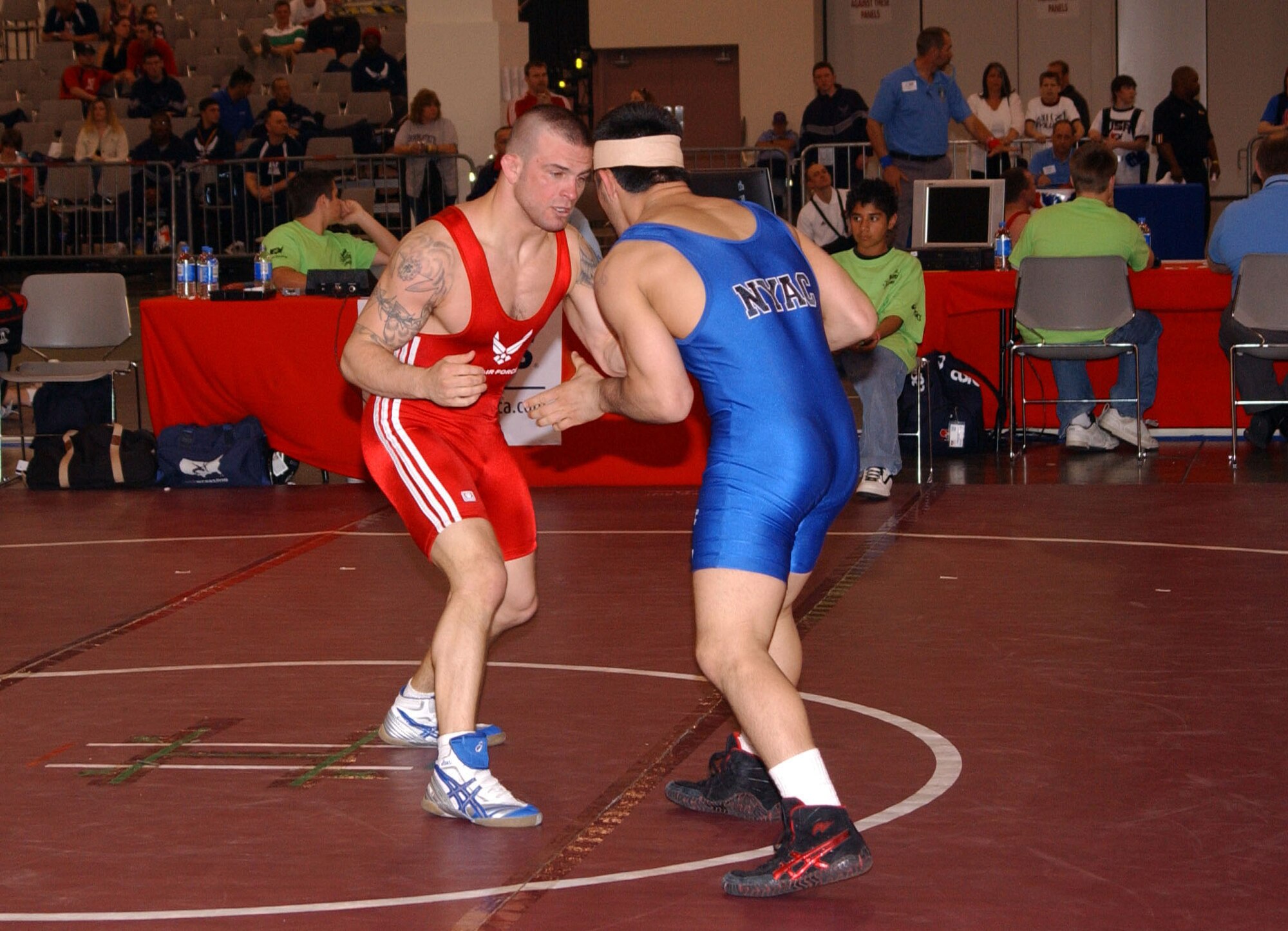 Air Force Staff Sgt. Jacob Hey (red) matches up against Marco Lara (blue) in a Greco-Roman style match during the U.S. Wrestling Nationals in Las Vegas. Sergeant Hey won a bronze medal in Greco-Roman. He competes in the 66 kilogram (145-pound) division, and placed second in Freestyle wrestling and third in Greco-Roman in the Armed Forces tournament in March at Fort Carson, Colo. (U.S. Air Force photo by Staff Sgt. Jeremy Smith)                                