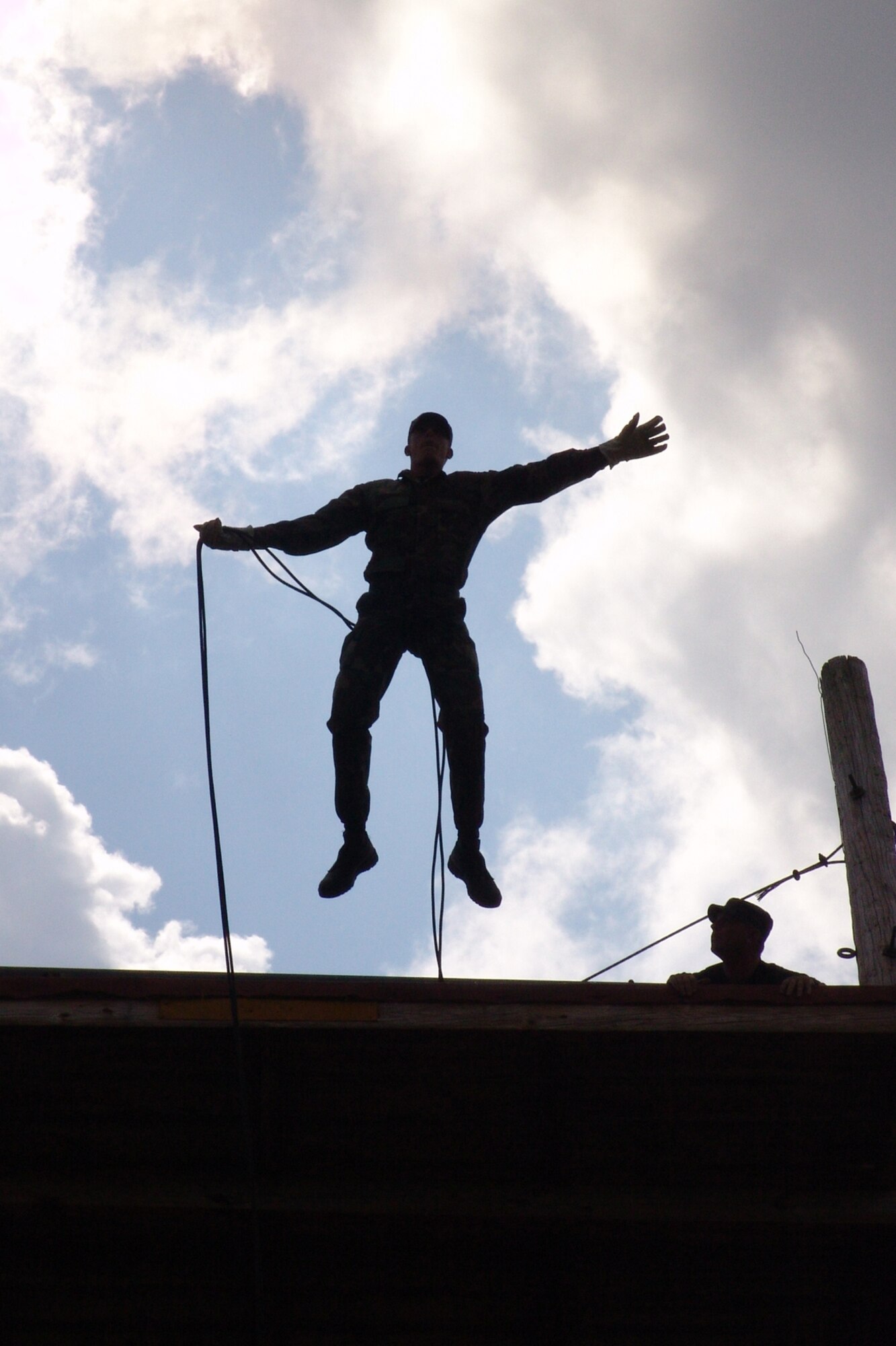 CAMP RUDDER, Fla. -- A U.S. Army Ranger instructor at the 6th Ranger Training Battalion leaps off the rappel tower during a previous Ranger Open House. The 6th RTB, stationed at Auxiliary Field 6 on the Eglin Air Force Base military reservation, will be hosting a 5k and 10k race prior to the Ranger Camp's annual Open House event May 6. Demonstrations will include rappelling, weapons, parachute as well as boat and reptile displays. (U.S. Air Force photo by Staff Sgt. Mike Meares)      