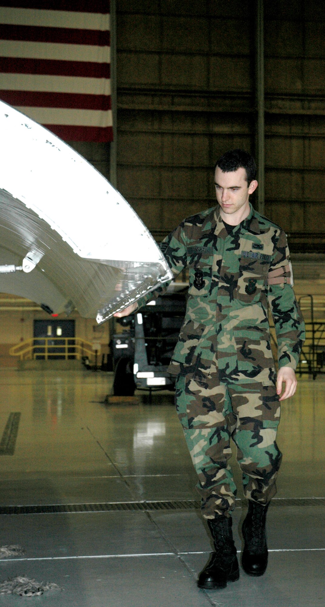 McCHORD AIR FORCE BASE, Wash. - Staff Sgt. Robert Marshall inspections a C-17 as part of his maintenance duties with the 446th Maintenance Squadron here.  Sergeant Marshall, a n Air Force Reserve Airman, returned to duty in March after battling non-Hodgkins lymphoma. U.S. Air Force photo/Sandra Pishner