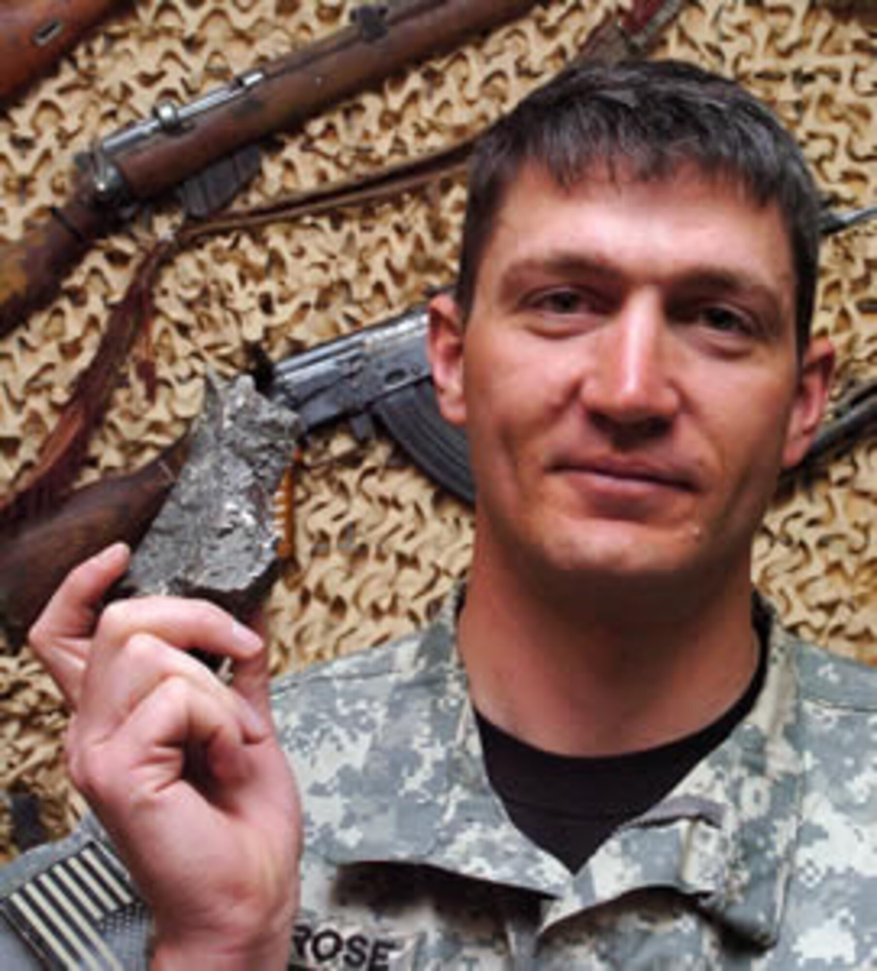 BAGRAM AIRFIELD, Afghanistan - Tech. Sgt. Daniel Montrose, 755 Explosive Ordnance Disposal team leader, holds up a five-pound piece of steel bomb casing recovered from the Soviet 500-pound bomb rendered safe April 8 in Charikar. Without protecive measures in place, an explosion caused by an accidental detonation would have launched this piece and larger ones at the speed of a bullet through houses, walls and people. Sergeant Montrose is a member of the 917 EOD, 917th Wing, Barksdale AFB, La. (U.S. Air Force photo by Staff Sgt. Thomas J. Doscher)  

