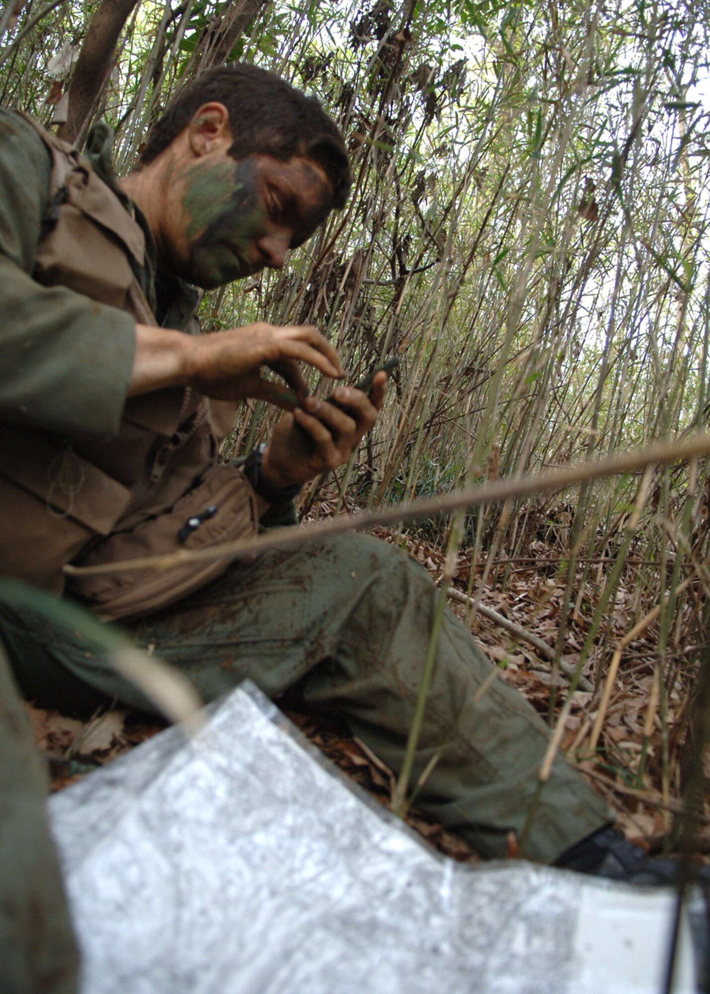 Capt. Pierre Alvarado practices survival techniques used if lost in hostile territory April 10 at the Tama Hills Recreation Center near Yokota Air Base, Japan. Captain Alvarado is from the 36th Airlift Squadron. (U.S. Air Force photo/Senior Airman Veronica Pierce)