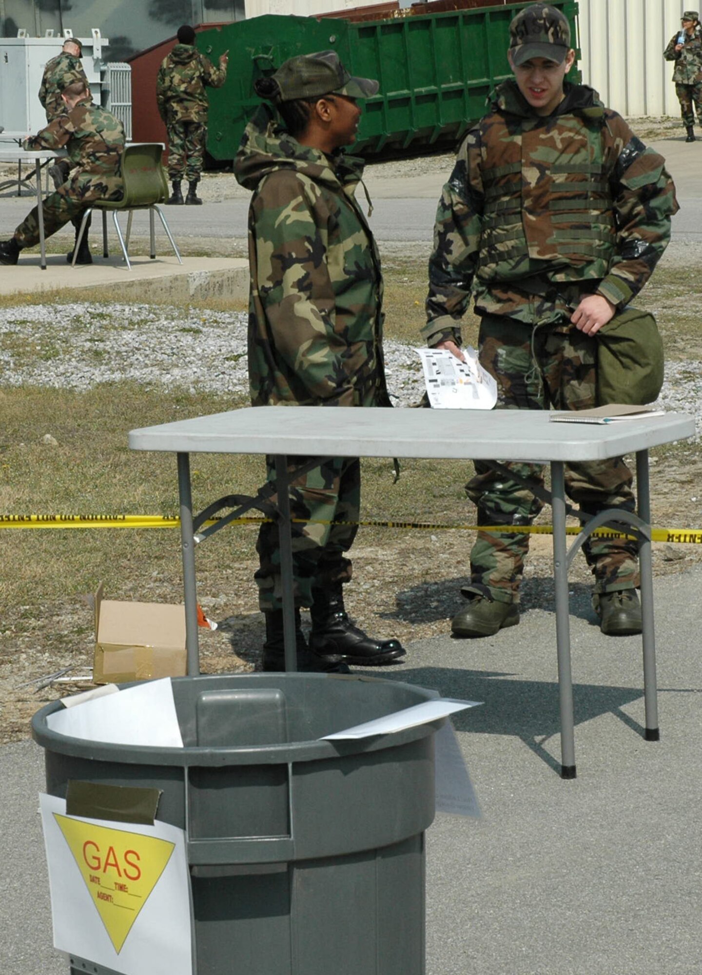 OSAN AIR BASE, Republic of Korea -- Senior Airman April Gipson (left), 51st Civil Engineer Squadron, explains the proper way to dispose of any materials that become contaminated after a chemical attack at the ATSO Rodeo Friday. (U.S. Air Force photo by Senior Airman Brok McCarthy)