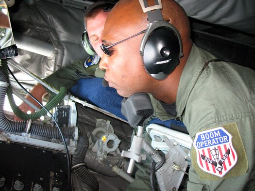 Tech. Sgt. Leslie Yarbough looks out of his boom pod while refueling an F-22 Raptor March 28. The Air Force's newest fighter jet is on its first overseas deployment. Sergeant Yarbough is a KC-135 Stratotanker boom operator from the 909th Air Refueling Squadron at Kadena Air Base, Japan. (U.S. Marine photo/Cpl. M. Todd Hunter)