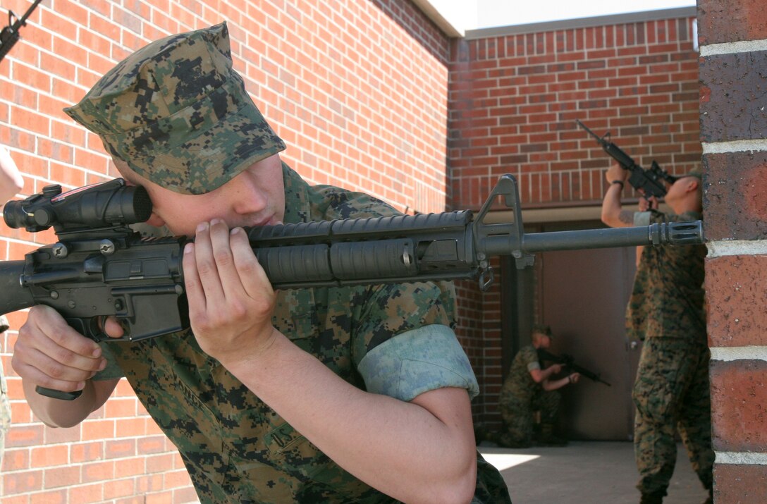 Cpl. Richard Colflesh, a vehicle commander for Alpha Battery, 2nd Low Altitude Air Defense Battalion, checks a vehicle for any suspicious items during a random vehicle checkpoint, April 12. Marines like Colflesh are part of the internal security battery for 2nd LAAD.