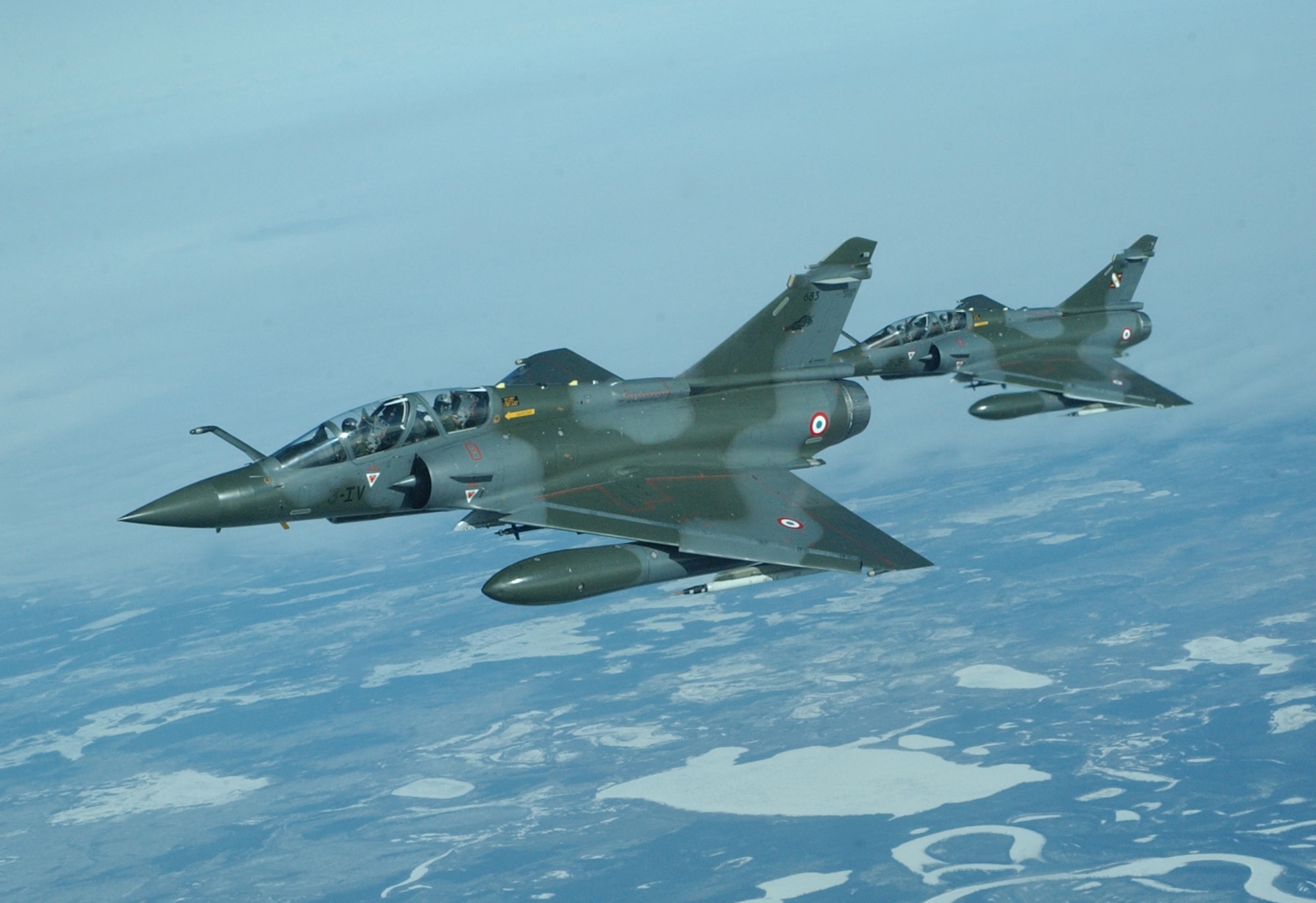 EIELSON AIR FORCE BASE, Alaska--Two French air force Mirage 2000 fighter jets fly alongside a KC-10 Extender during Red Flag-Alaska 07-1 April 11. Fighter jets typically require aerial refueling to fight and stay in the fight longer. (U.S. Air Force photo by Senior Airman Justin Weaver).                      