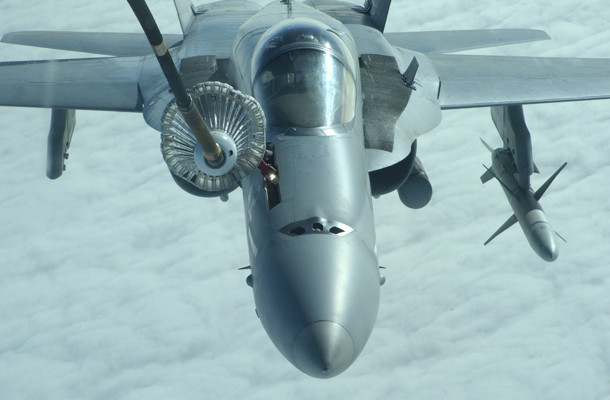 EIELSON AIR FORCE BASE, Alaska--A Navy F-18 Hornet receives fuel from the trailing drogue of a KC-10 Extender during Red Flag-Alaska 07-1 April 11. Red Flag-Alaska is a Pacific Air Forces-directed field training exercise for U.S. forces flown under simulated air combat conditions. It is conducted on the Pacific Alaskan Range Complex with air operations flown out of Eielson and Elmendorf Air Force Bases. (U.S. Air Force photo by Senior Airman Justin Weaver). 
              