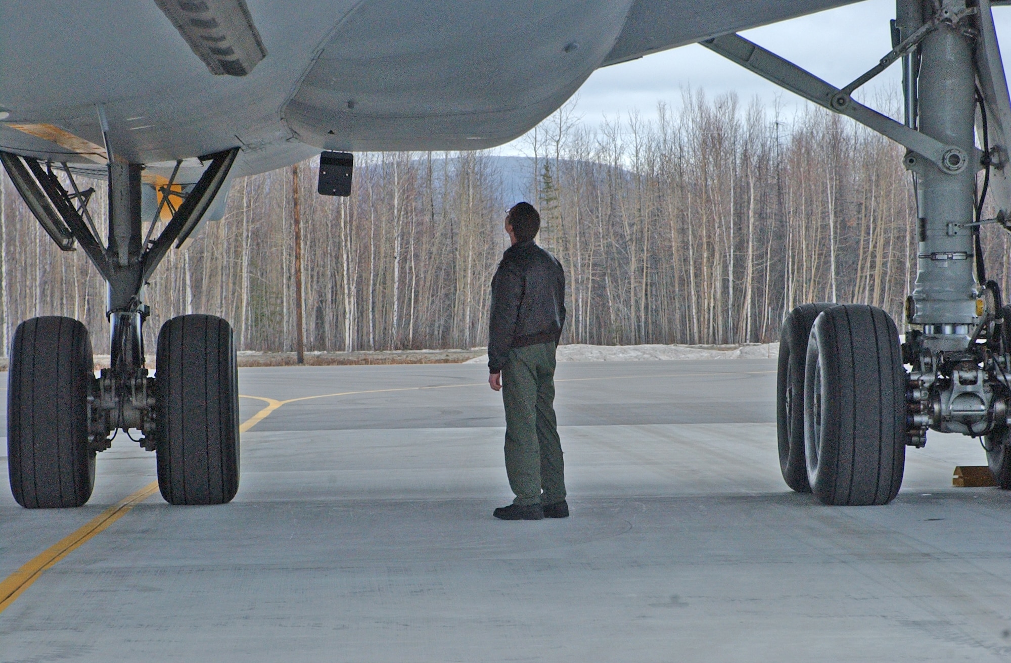 EIELSON AIR FORCE BASE, Alaska--Tech. Sgt. David Seyl, 9th Air Refueling Squadron flight engineer, performs post-flight safety checks on a KC-10 Extender after a Red Flag-Alaska 07-1 refueling flight April 11. The KC-10 can transport up to 75 people and nearly 170,000 pounds of cargo a distance of about 4,400 miles unrefueled.(U.S. Air Force photo by Senior Airman Justin Weaver).