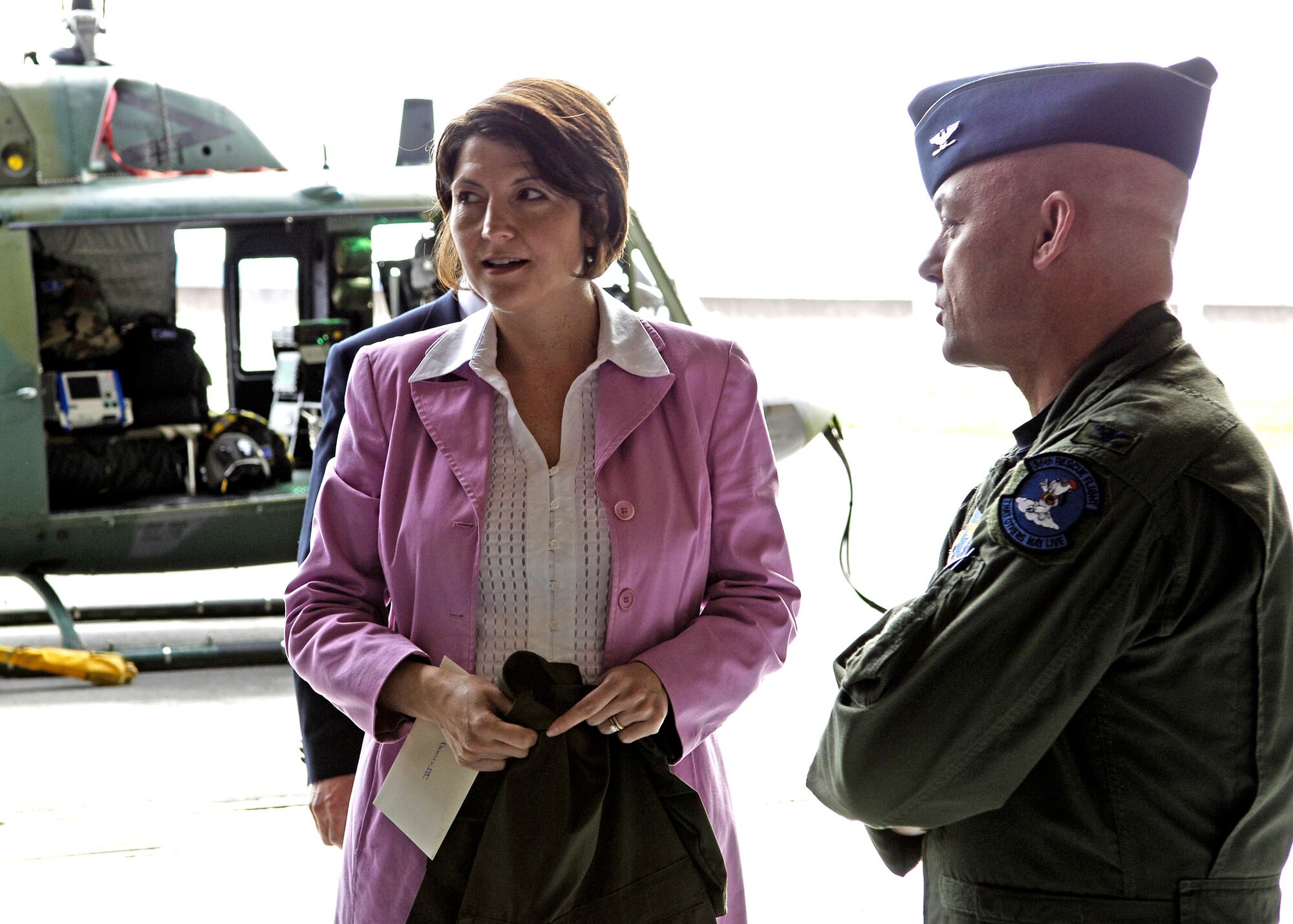 FAIRCHILD AIR FORCE BASE, Wash. -- Representative Cathy McMorris-Rodgers discusses the 36th Rescue Flight and their mission with Col. Jeffrey White, commander of the 336th Training Group. (U.S. Air Force photo/Senior Airman Anthony Ennamorato)