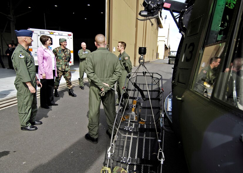 FAIRCHILD AIR FORCE BASE, Wash. -- Col. Jeffrey White, 336th Training Group commander; Representative Cathy McMorris-Rodgers; Chief Master Sgt. William Welch, 336th TRG command chief and Maj. Brian Bell, 36th Rescue Flight commander, discuss the UH-1N Huey helicopter with two enlisted members of the 36th RQF. The 36th RQF has rescued over 600 individuals since it was established. (U.S. Air Force photo/Senior Airman Anthony Ennamorato)