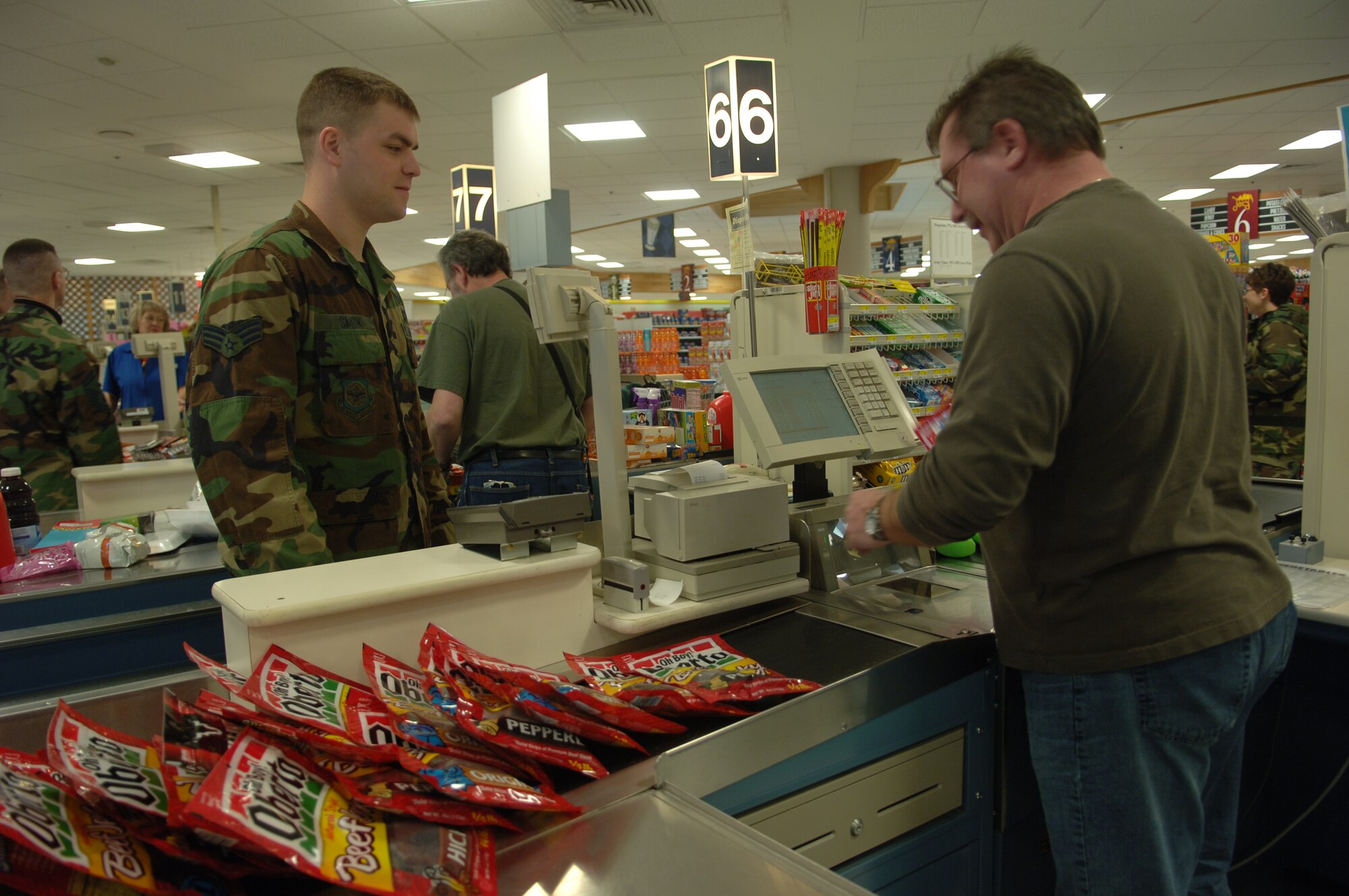 FAIRCHILD AIR FORCE BASE, Wash. -- Senior Airman Amos Smith, 92nd Civil Engineer Squadron Explosive Ordinance Disposal technician, has his groceries totaled during a $200 shopping spree in the commissary April 11. Airman Smith was named Airman of the year for 2006.

