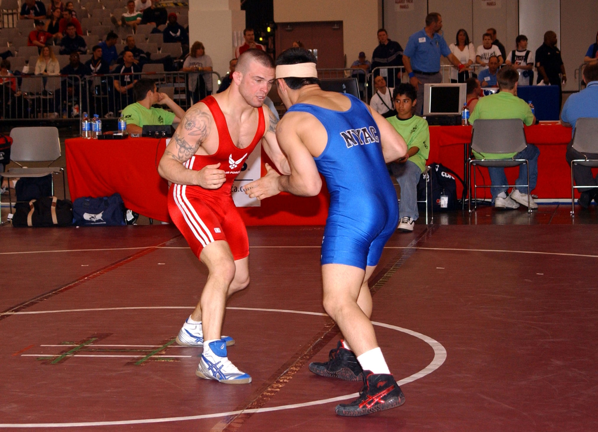 Jacob Hey (left) matches up against Marco Lara in a Greco-Roman style match April 7 at the Las Vegas Convention Center. Hey, a staff sergeant from Scott Air Force Base, Ill. earned the silver in freestyle wrestling and the bronze in Greco-Roman at the Armed Forces tournament. (U.S. Air Force photo/Staff Sgt. Jeremy Smith) 