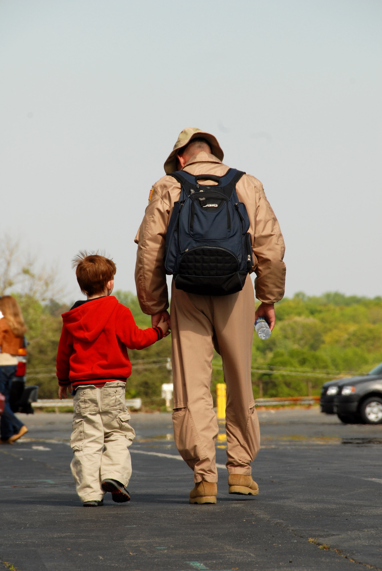 Maj. Kevin Mountcastle walks with his son after arriving back home April 6 from supporting Operation Enduring Freedom to Charlotte, N.C. Major Mountcastle is a C-130 Hercules pilot assigned to the 145th Airlift Wing for the North Carolina Air National Guard, and is returning from a tour of duty in Afganistan. (U.S. Air Force photo/Tech. Sgt. Brian E. Christiansen)