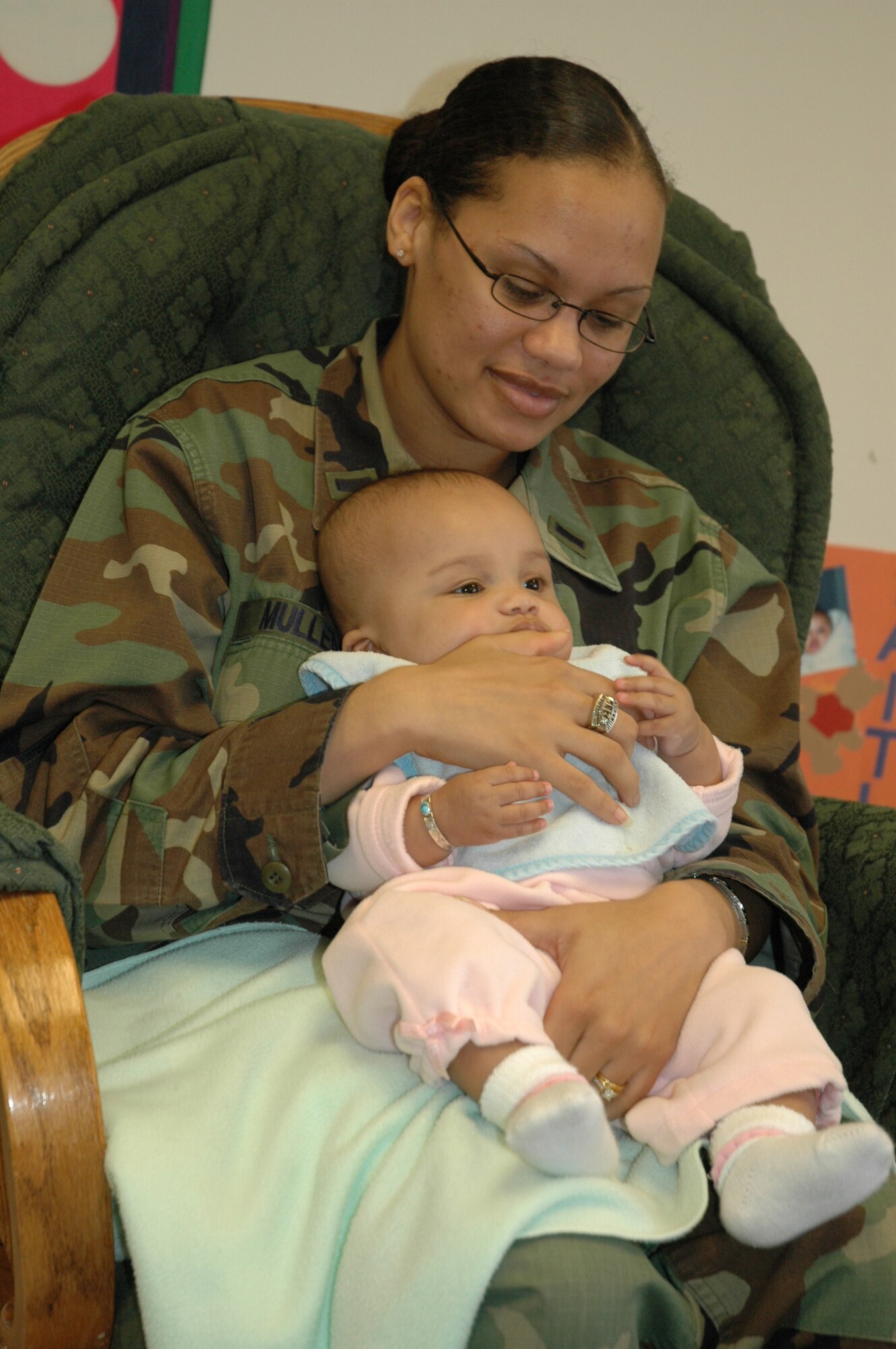 First Lieutenant Kristen Mullen, 22nd Mission Support Squadron, plays with her daughter, Kaitlynn, 6 months, at the Child Development Center April 11 during the Annual Month of the Military Child luncheon.  (Air Force photo by Tech. Sgt. Genevieve Morris 22nd ARW Public Affairs)
