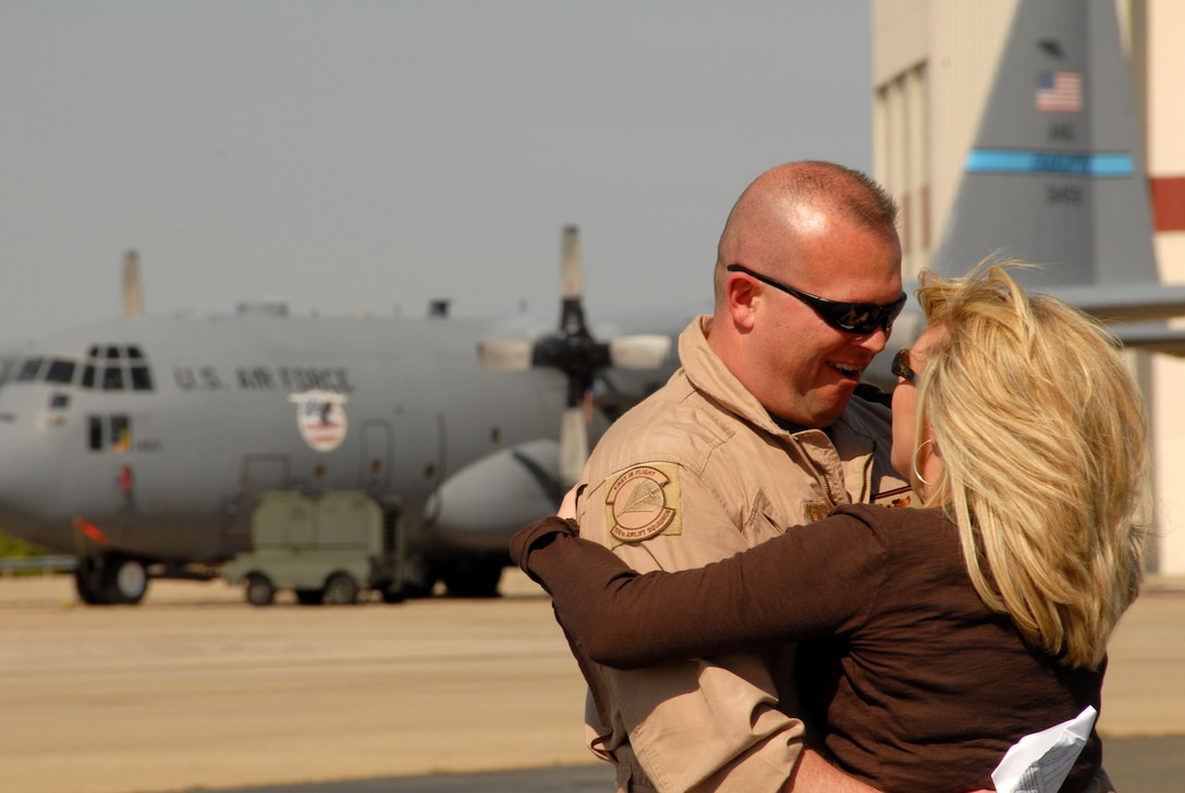 Master Sgt. David Lee hugs his girlfriend, Crystie Wilkins, as he arrives back home April 6 from supporting Operation Enduring Freedom to Charlotte, N.C. Sergeant Lee is a C-130 Hercules loadmaster assigned to the 145th Airlift Wing for the North Carolina Air National Guard. He and his unit were deployed in Afghanistan. (U.S. Air Force photo/Tech. Sgt. Brian E. Christiansen)
