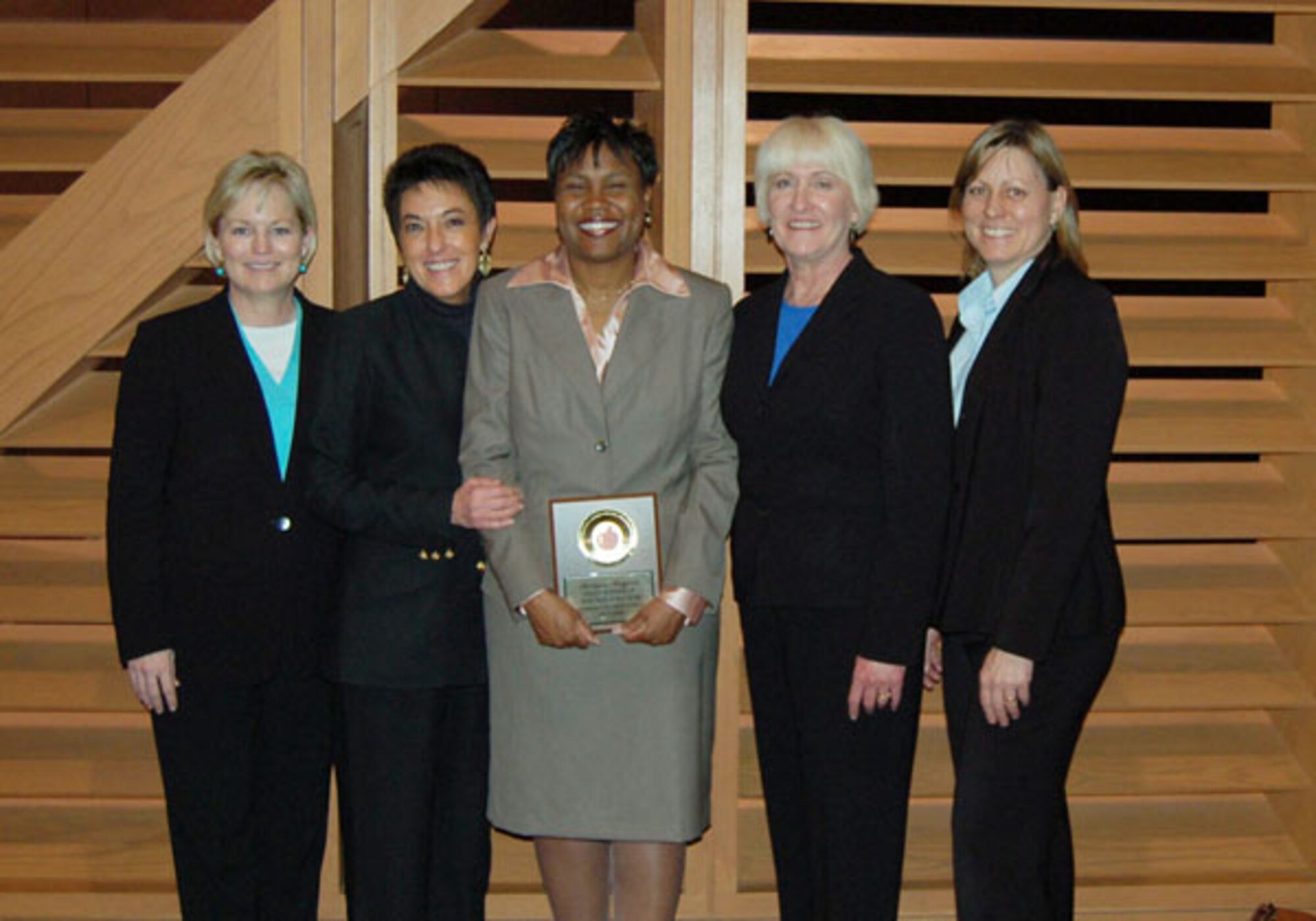 Air Force Reservist Roslynn Rayford, center, poses with, from left, Paula Armstrong, Language Arts Teacher; Karen Waddell, Principal’s secretary; Principal Lynn Kellert; and Linda Meier, Science Teacher. Rayford was selected as one of Oklahoma state's top teachers of the year for 2007. The captain is also a Military Equal Opportunity Officer with the 507th Air Refueling Wing.