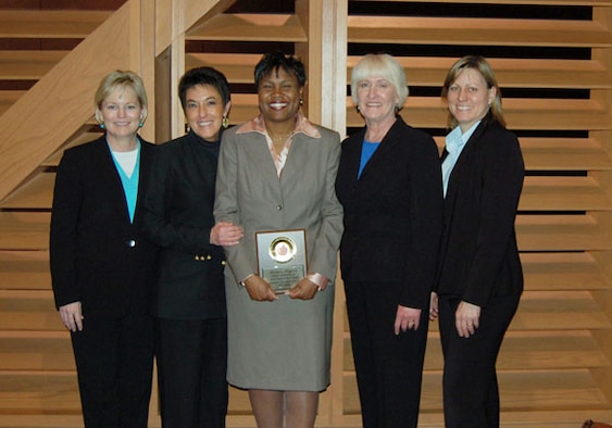 Air Force Reservist Roslynn Rayford, center, poses with, from left, Paula Armstrong, Language Arts Teacher; Karen Waddell, Principal’s secretary; Principal Lynn Kellert; and Linda Meier, Science Teacher. Rayford was selected as one of Oklahoma state's top teachers of the year for 2007. The captain is also a Military Equal Opportunity Officer with the 507th Air Refueling Wing.