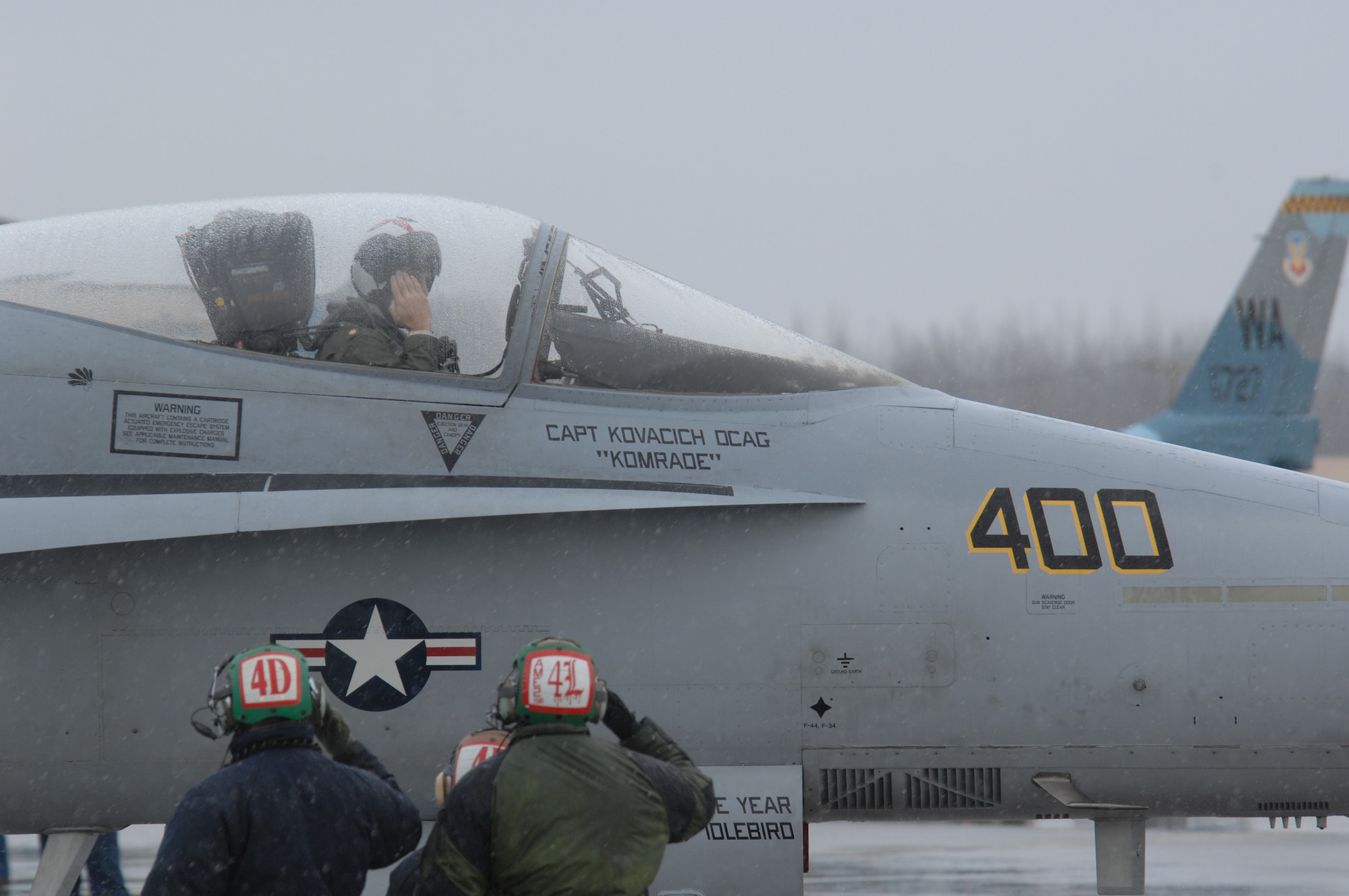 EIELSON AIR FORCE BASE, Alaska -- Navy crew members from Strike Fighter Squadron Eight Seven (VFA-87) salute an F/A-18 pilot prior to a mission during Red Flag-Alaska 07-1 here on April 12. Red Flag-Alaska is a Pacific Air Forces-directed field training exercise for U.S. forces flown under simulated air combat conditions. It is conducted on the Pacific Alaskan Range Complex with air operations flown out of Eielson and Elmendorf Air Force Bases. 
(U.S. Air Force Photo by Staff Sgt Joshua Strang) 