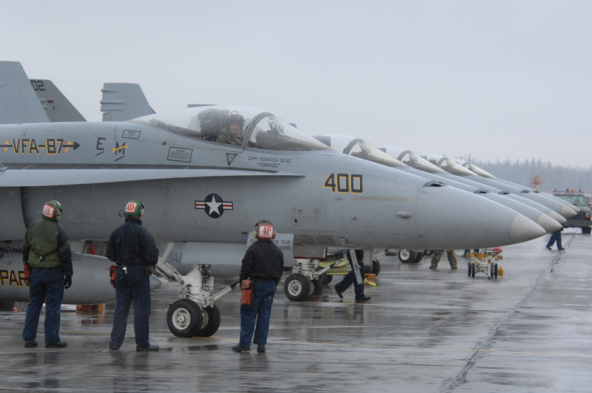 EIELSON AIR FORCE BASE, Alaska -- Navy crew members from Strike Fighter Squadron Eight Seven (VFA-87) ready an F/A-18 prior to a mission during Red Flag-Alaska 07-1 here on April 12. Red Flag-Alaska is a Pacific Air Forces-directed field training exercise for U.S. forces flown under simulated air combat conditions. It is conducted on the Pacific Alaskan Range Complex with air operations flown out of Eielson and Elmendorf Air Force Bases. 
(U.S. Air Force Photo by Staff Sgt Joshua Strang) 