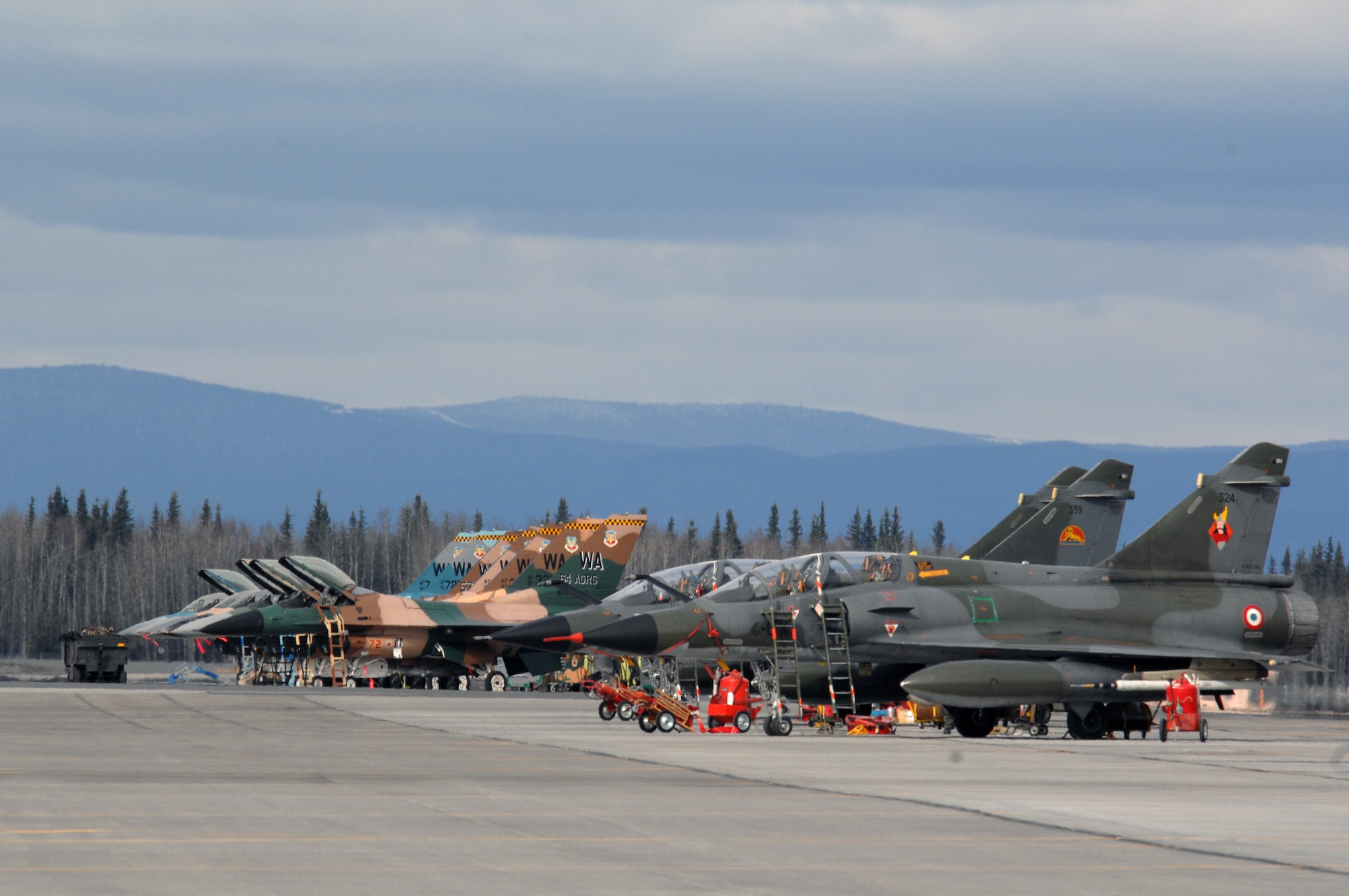 EIELSON AIR FORCE BASE, Alaska -- French Dassault M2000 Mirage aircraft, Armee de l'Air, and F-16 Fighting Falcon aircraft, 64th Aggressor Squadron, Nellis Air Force Base, Nevada are showcased on the flightline during Red Flag-Alaska 07-1 here on April 11. Red Flag-Alaska is a Pacific Air Forces-directed field training exercise for U.S. forces flown under simulated air combat conditions. It is conducted on the Pacific Alaskan Range Complex with air operations flown out of Eielson and Elmendorf Air Force Bases. 
(U.S. Air Force Photo by Staff Sgt Joshua Strang) 