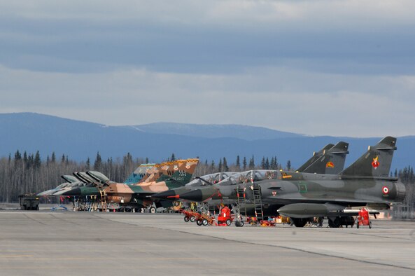EIELSON AIR FORCE BASE, Alaska -- French Dassault M2000 Mirage aircraft, Armee de l'Air, and F-16 Fighting Falcon aircraft, 64th Aggressor Squadron, Nellis Air Force Base, Nevada are showcased on the flightline during Red Flag-Alaska 07-1 here on April 11. Red Flag-Alaska is a Pacific Air Forces-directed field training exercise for U.S. forces flown under simulated air combat conditions. It is conducted on the Pacific Alaskan Range Complex with air operations flown out of Eielson and Elmendorf Air Force Bases. 
(U.S. Air Force Photo by Staff Sgt Joshua Strang) 