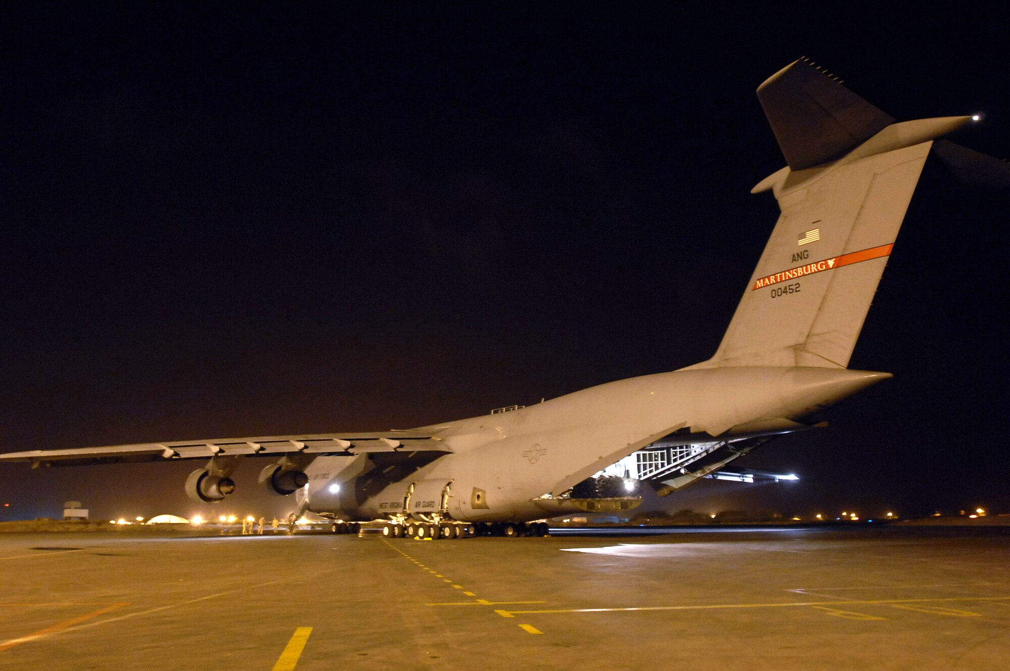 Crews remove one of two Marine CH-53E Super Stallion helicopters from a C-5 Galaxy April 10 in Djibouti, Africa. The Galaxy's overseas journey was a first for the West Virginia Air National Guard's 167th Airlift Wing, a unit that recently gained the massive airframe capable of transporting oversized cargo to any theater of combat on the globe. (U.S. Air Force photo/Tech. Sgt. Lee Harshman)