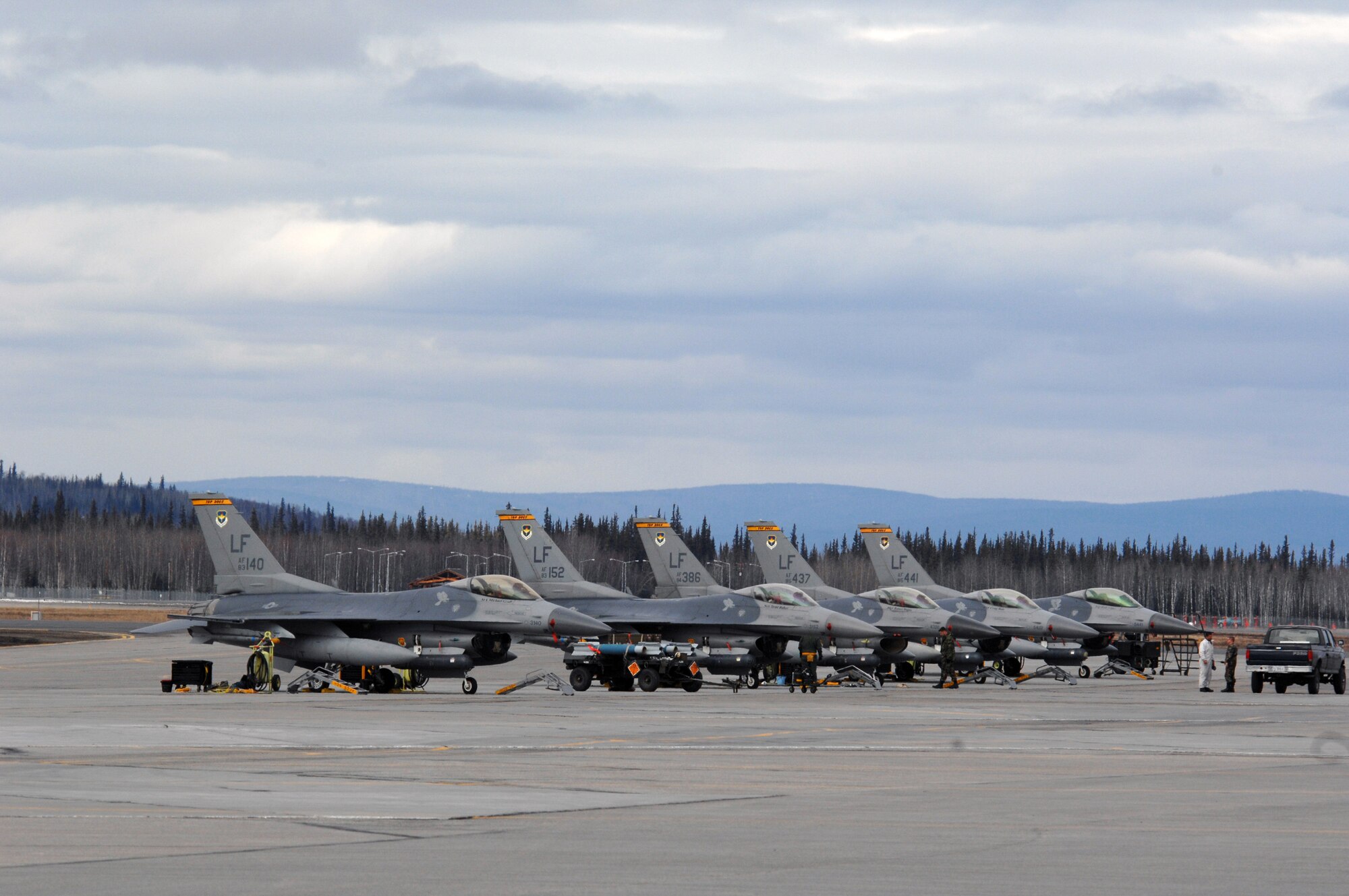 EIELSON AIR FORCE BASE, Alaska -- F-16 Fighting Falcon aircraft from the 61st Fighter Squadron, Luke Air Force Base, Arizona are readied for take off prior to  missions during Red Flag-Alaska 07-1 here on April 11. Red Flag-Alaska is a Pacific Air Forces-directed field training exercise for U.S. forces flown under simulated air combat conditions. It is conducted on the Pacific Alaskan Range Complex with air operations flown out of Eielson and Elmendorf Air Force Bases. 
(U.S. Air Force Photo by Staff Sgt Joshua Strang) 