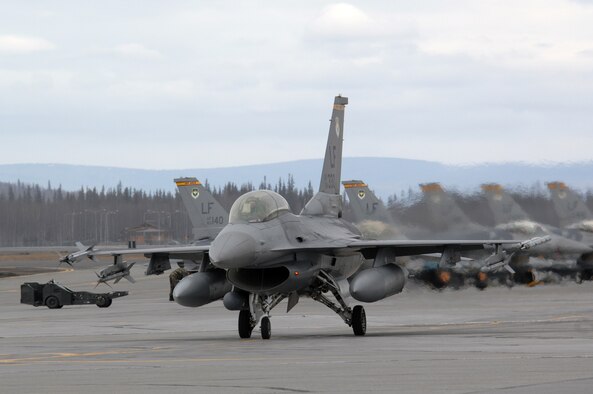 EIELSON AIR FORCE BASE, Alaska -- An F-16 Fighting Falcon from the 61st Fighter Squadron, Luke Air Force Base, Arizona taxis prior to a mission during Red Flag-Alaska 07-1 here on April 11. Red Flag-Alaska is a Pacific Air Forces-directed field training exercise for U.S. forces flown under simulated air combat conditions. It is conducted on the Pacific Alaskan Range Complex with air operations flown out of Eielson and Elmendorf Air Force Bases. 
(U.S. Air Force Photo by Staff Sgt Joshua Strang) 