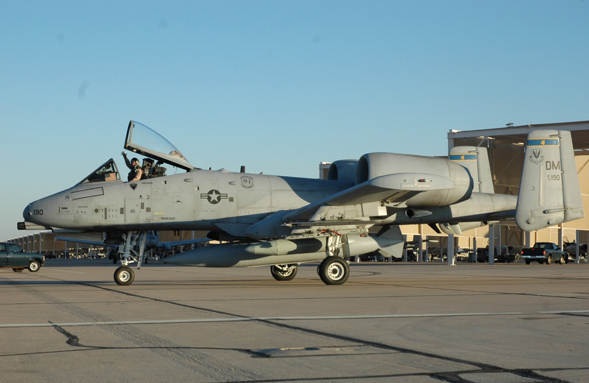 An A-10 pilot from the 354th Fighter Squadron here waves to friends, family members and colleagues on D-M's flight line before taxiing out to the runway for takeoff. Twelve pilots from the 354th FS deployed Saturday to Afghanistan to support Operation Enduring Freedom. (U.S. Air Force photo/Airman 1st Class Melissa Taeu)