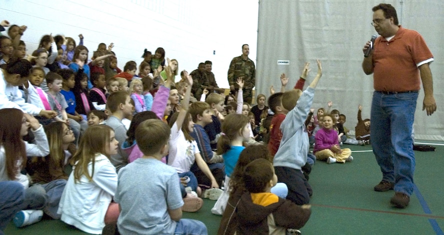 MINOT AIR FORCE BASE, N.D. – Children’s author Sam Renick, performs an interactive reading of his book "It's a Habit, Sammy Rabbit" at the youth center here April 11. The story educates children and families about the importance of saving money. The event was sponsored by the Air Force Aid Society as a part of National Financial Literacy Month. (U.S. Air Force photo by Senior Airman Danny Monahan)