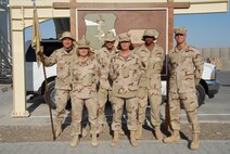 SOUTHWEST ASIA -- Six Airmen from Minot Air Force Base make up the Personnel Support for Contingency Operations team at a forward deployed location in Southwest Asia. The PERSCO team’s deployed mission is to track arriving and departing Airmen assigned to the area of responsibility, update duty statuses, complete casualty reporting and other personnel management functions. From left to right: Tech. Sgt. Lowell Cormier, Senior Master Sgt. Andrea Johnson, Staff Sgt. Robert Walsh, Tech. Sgt. Patricia Pryor, Airman 1st Class Cory Tolbert and 1st Lt. Jordan Trezza all are deployed with the 380th Air Expeditionary Wing to Southwest Asia in support of Operation Enduring Freedom, Operation Iraqi Freedom, and the Combined Task Force--Horn of Africa. (U.S. Air Force photo by Master Sgt. Rebecca Roady)