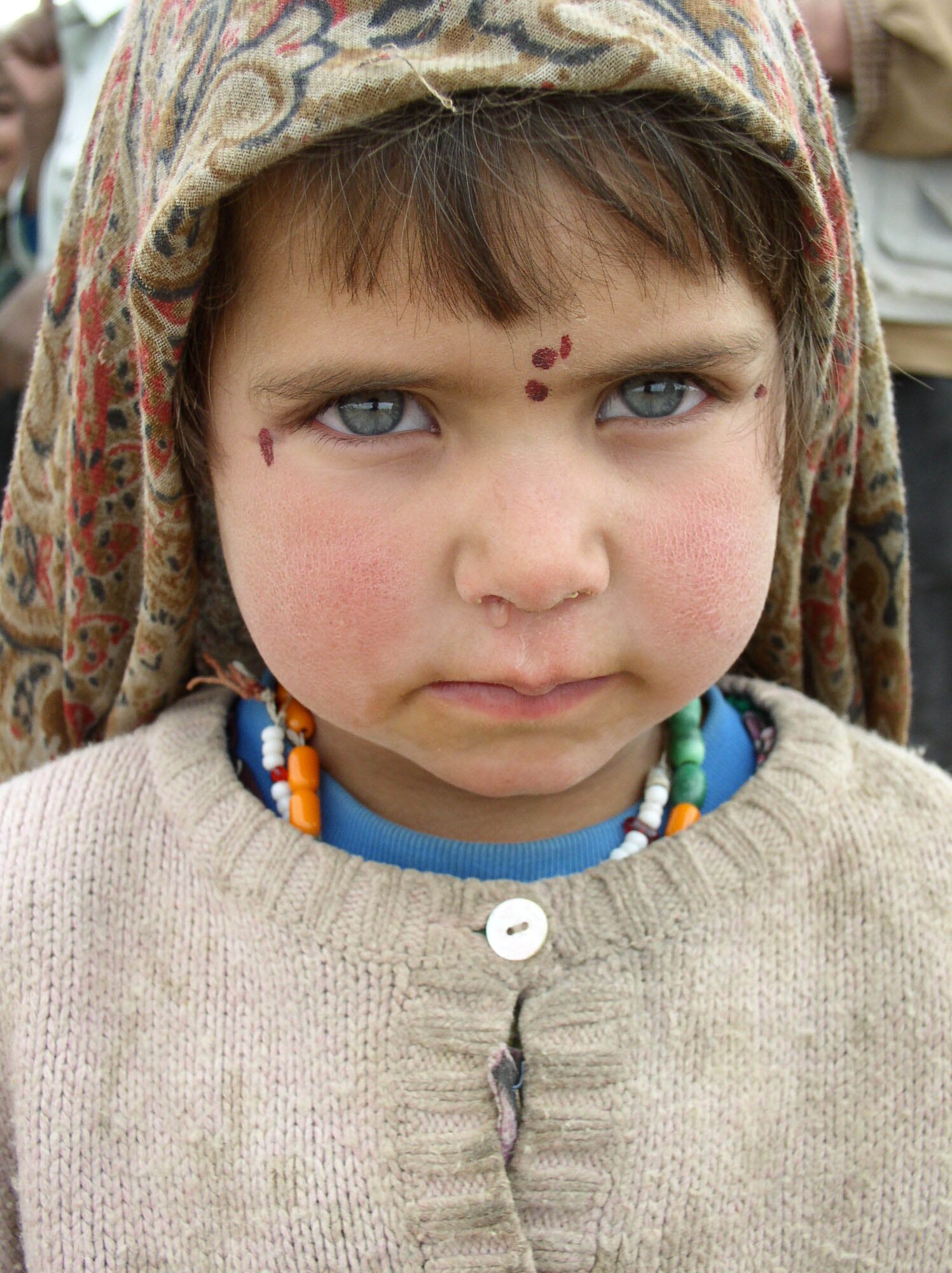 This young girl pictured in Zangalan was described by Sergeant Nale as a beautiful young girl he just had to take a picture of. He said it was sad as you go closer to her face you could see how harsh the elements had been to her because her checks seemed burned by the wind. “In her face you could just see the hard life she had a head of her,” Sergeant Nale said.