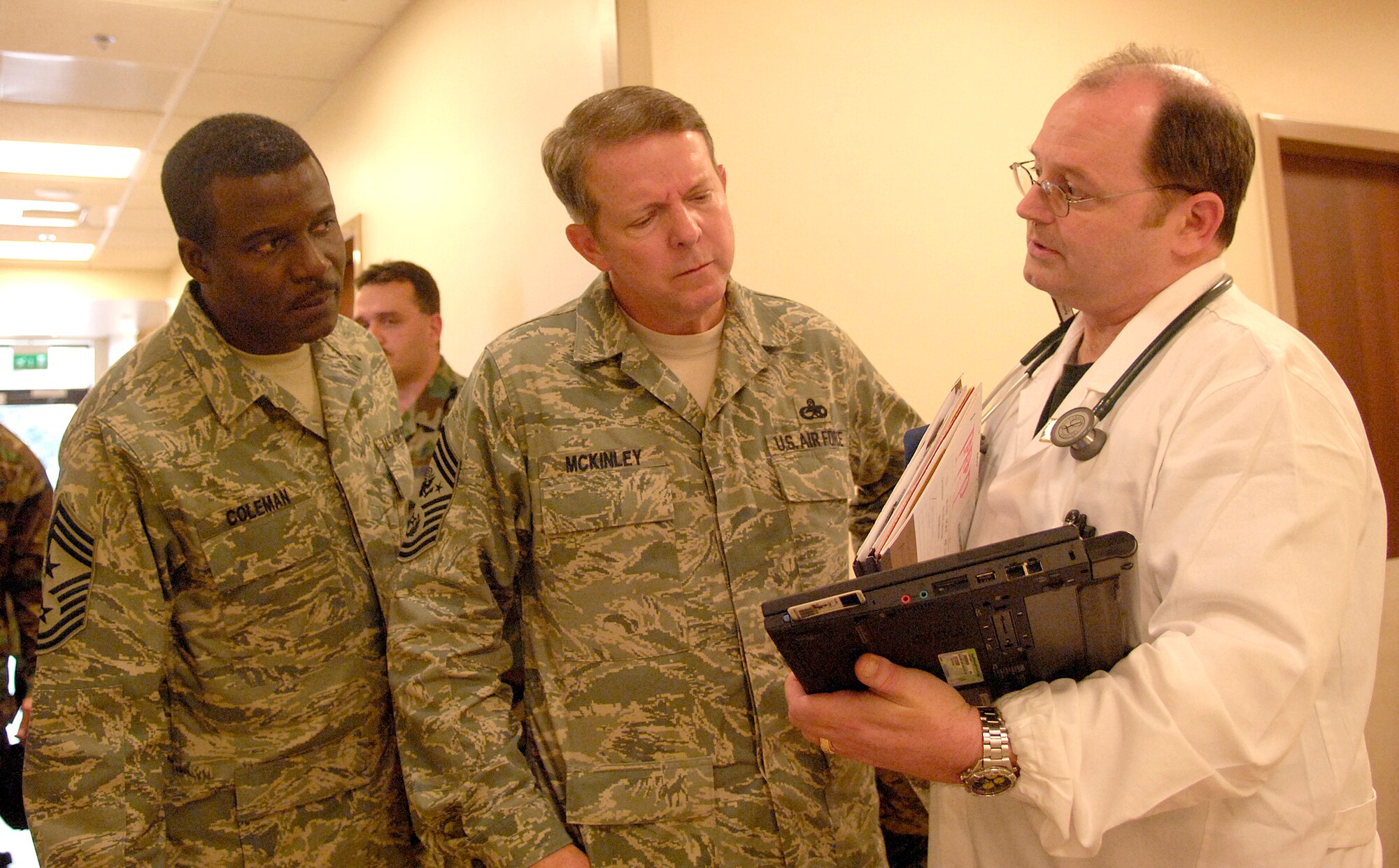 Chief Master Sgt. of the Air Force Rodney J. McKinley and U.S. Air Forces in Europe Command Chief Master Sgt. Gary Coleman learn about new equipment from Capt. Charles Cooley, 31st Medical Operations Squadron nurse practicioner, at the Military Treatment Facility April 10. (U.S. Air Force photo by Airman 1st Class Michael Dorus)