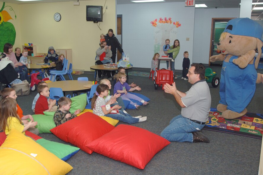Sammy "The Saver" Rabbit sings his theme song to kids at the escape zone April 10. Sammy "The Saver" Rabbit teaches children and families the importance of saving money through music and reading. (U.S. Air Force photo/Airman 1st Class Chad Kellum)