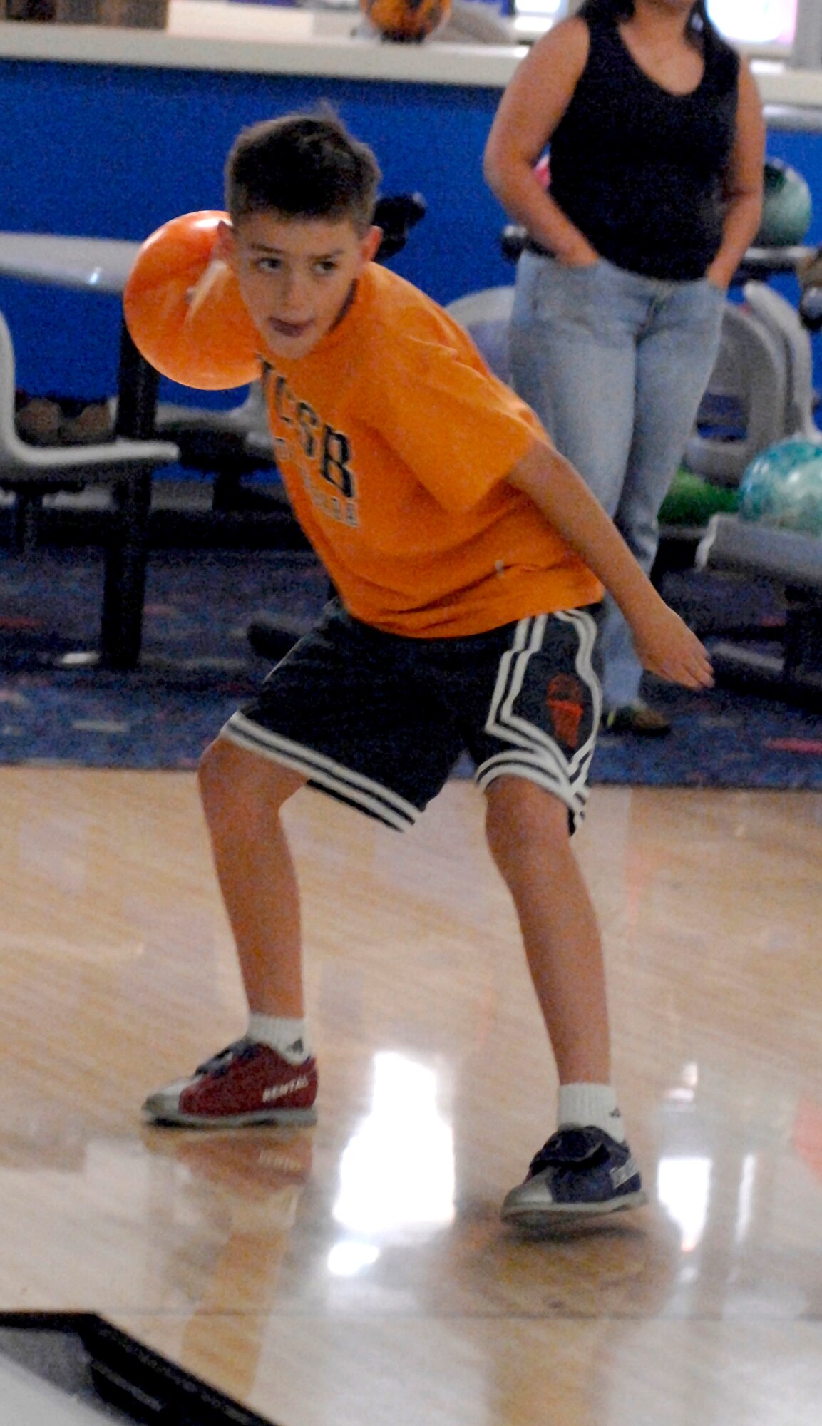 Tyler Ellison practices his bowling techniques during the Hooked Up 2 Bowling camp April 9. The camp taught children the basics of bowling, and gave them  hands-on experience with an instructor. (U.S. Air Force photo by Airman 1st Class Liliana Moreno)