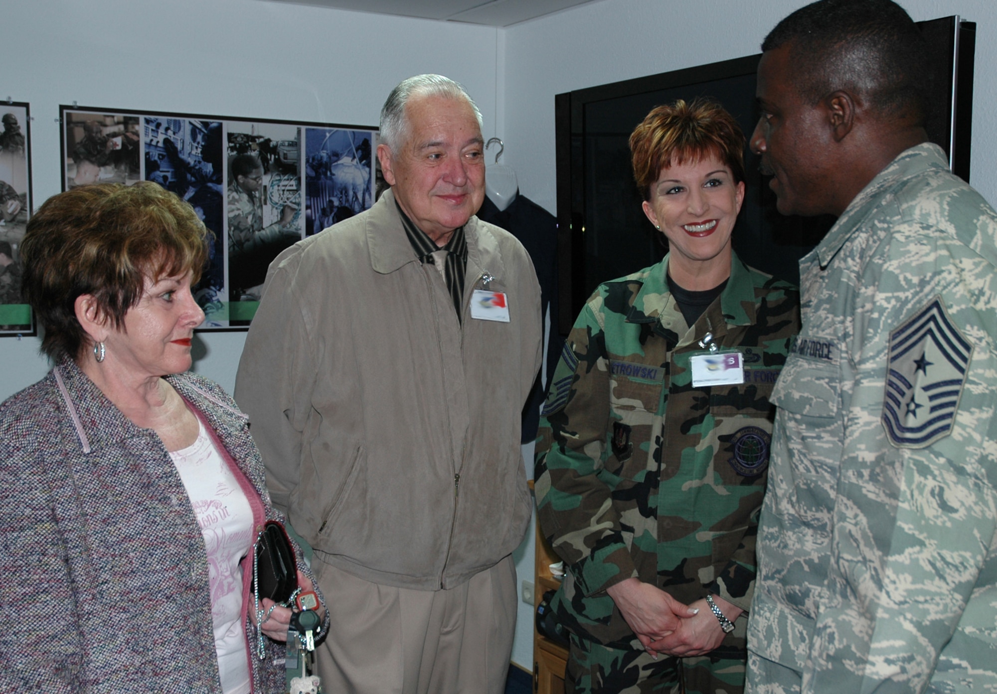 RAMSTEIN AIR BASE, GERMANY -- US Air Forces in Europe Command Chief Master Sgt. Gary Coleman, talks with Senior Master Sgt. Debbie Pietrowski, 52nd Communications Squadron, and her parents at the Parish Enlisted Heritage Room March 29. (Photo by Master Sgt. Chuck Roberts)