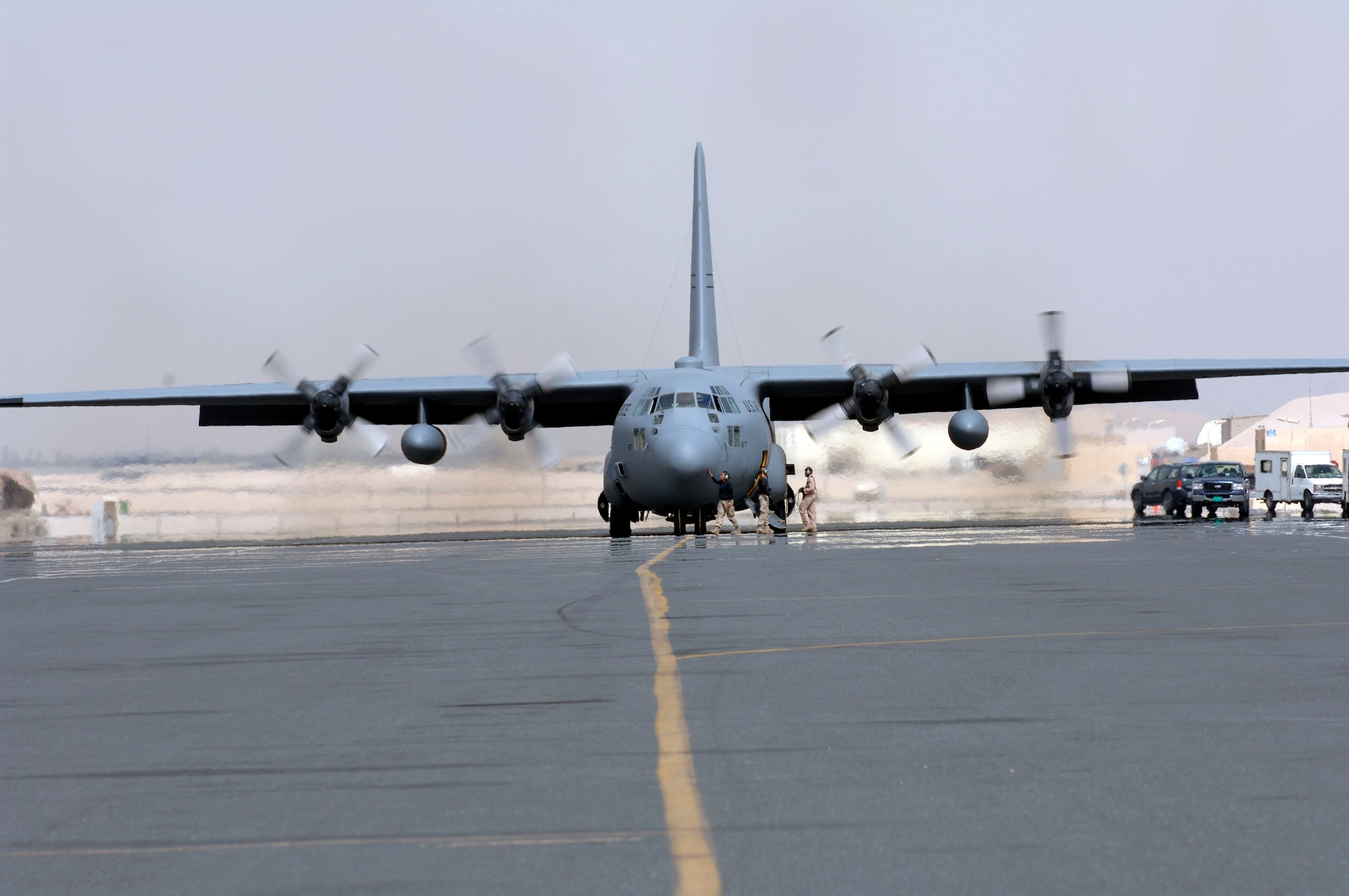 Ground crews prepare a C-130 Hercules for take off before a recent mission. The C-130 is assigned to the 746th Expeditionary Airlift Squadron. Every week, the 746th EAS contributes to the 379th Air Expeditionary Wing delivering more than 1,500 tons of cargo to forward deployed locations. They also transport hundreds of servicemembers in support of operations in Iraq, Afghanistan and the Horn of Africa. (U.S. Air Force/Staff Sgt. David Miller)