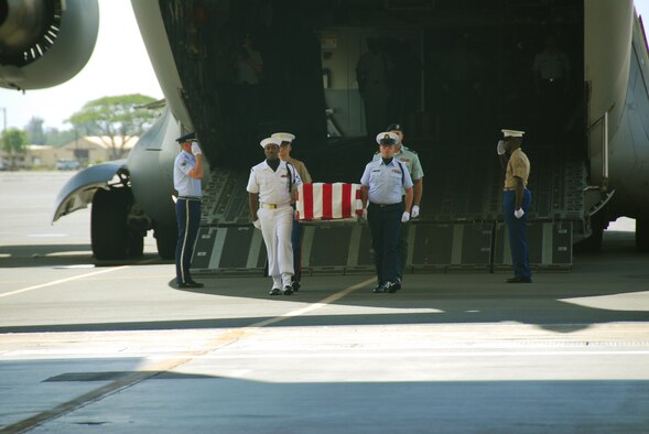 HICKAM AIR FORCE BASE, Hawaii -- The Joint POW/MIA Accounting Command performs an arrival ceremony at Hickam AFB, Hawaii, April 12, 2007. The ceremony was for U.S. service members from the Korean War.  An official delegation from the United States traveled to North Korea to accept the remains from the government.  JPAC's mission is to achieve the fullest possible accounting of all Americans missing as a result of our nation's previous conflicts. (JPAC photo by Staff Sgt. Valda G. Wilson)