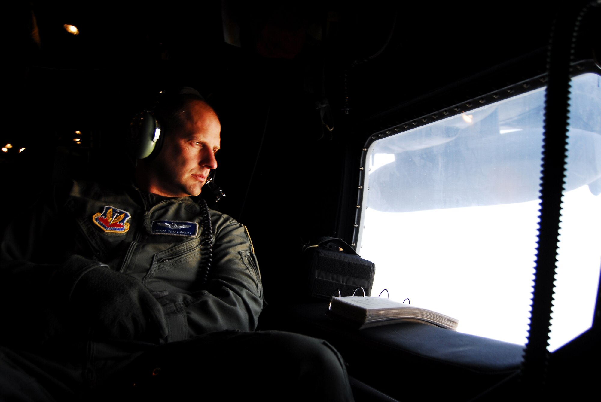 Senior Master Sgt. Thomas Lovett, Air Combat Command's HC-130P loadmaster career field functional manager, awaits his portion of a night HC-130P training mission April 10 over Moody Air Force Base, Ga. Aircraft loadmasters are responsible for the proper placement and safe delivery of cargo on transport and rescue aircraft.    (U.S. Air Force photo by Tech. Sgt. Parker Gyokeres)