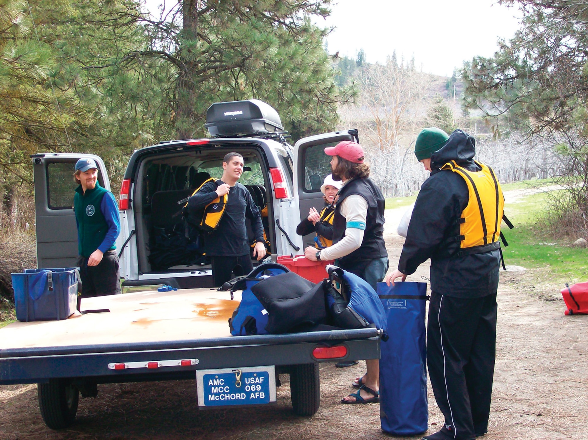 LEAVENWORTH, Wash.--After arriving at the Wenatchee River, rafters from McChord unpack their gear. (U.S. Air Force Photo)

