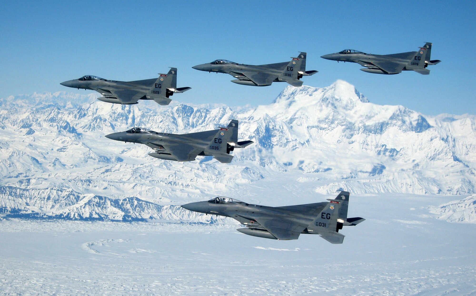 Five 60th Fighter Squadron F-15Cs, from the 33rd Fighter Wing, Eglin Air Force Base, Fla., soar over the mountains ranges of Alaska during their overseas deployment to Elmendorf Air Force Base, Alaska to participate in Red Flag Alaska 07-1 preparing them for their Air Expeditionary Force 9/10 window. Approximately 16 F-15s and more than 240 Airmen will traveled to Elmendorf March 28 as part of the deployment. 
