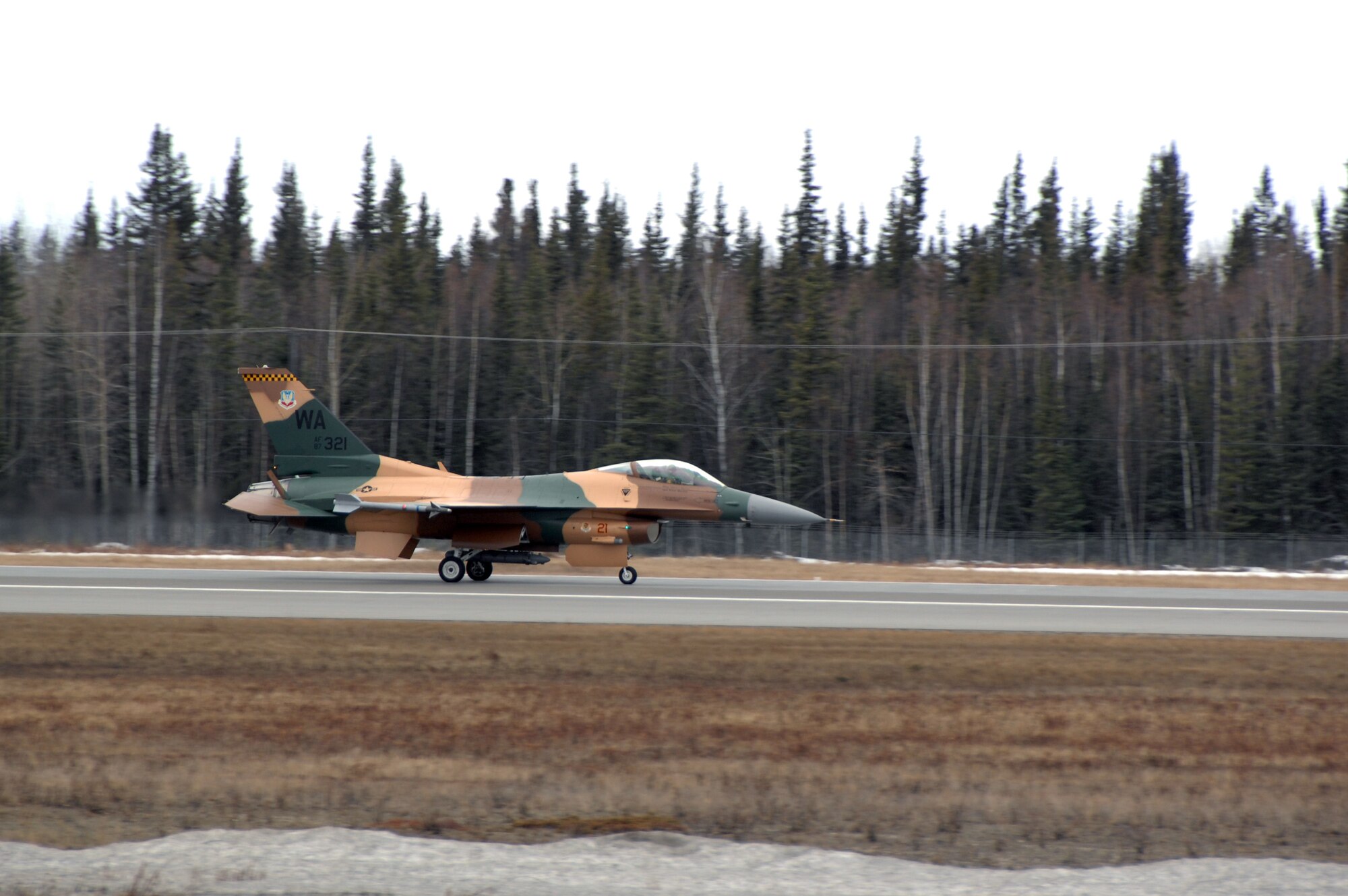 EIELSON AIR FORCE BASE, Alaska -- A 64th Aggressor Squadron F-16 lands after a mission during Red Flag-Alaska 07-1. Red Flag-Alaska is a Pacific Air Forces-directed field training exercise for U.S. forces flown under simulated air combat conditions. It is conducted on the Pacific Alaskan Range Complex with air operations flown out of Eielson and Elmendorf Air Force Bases. 
(U.S. Air Force Photo by Staff Sgt Joshua Strang) 
