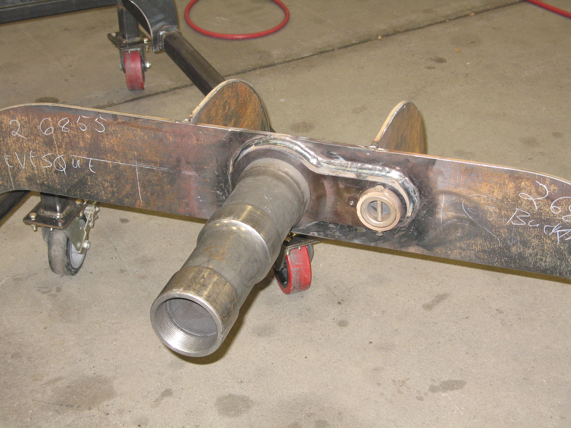 MCCHORD AIR FORCE BASE, Wash.-- The nose wheel trainers designed by Master Sgt. Barry Buchmiller, 62nd Aircraft Maintenance Squadron, pictured here, will save the Air Force money by freeing up C-17 Globemaster IIIs from ground training. The trainers are used to help Airmen learn how to change the wheels on the nose landing gear assembly.
(U.S. Air Force Photo)
