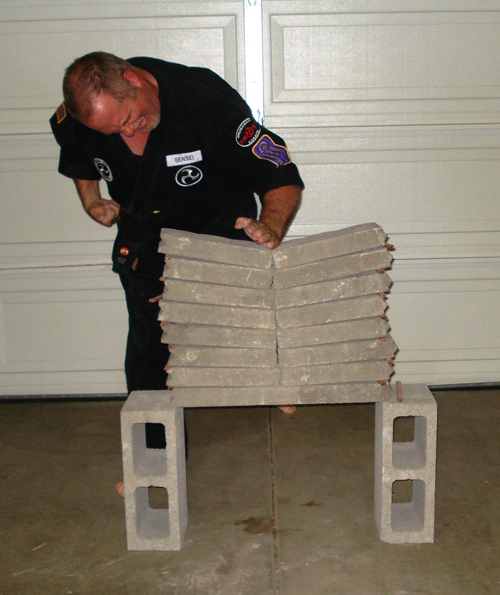 Master Greg Trumbull breaks through eight 2-inch slabs of concrete. (Courtesy photo)