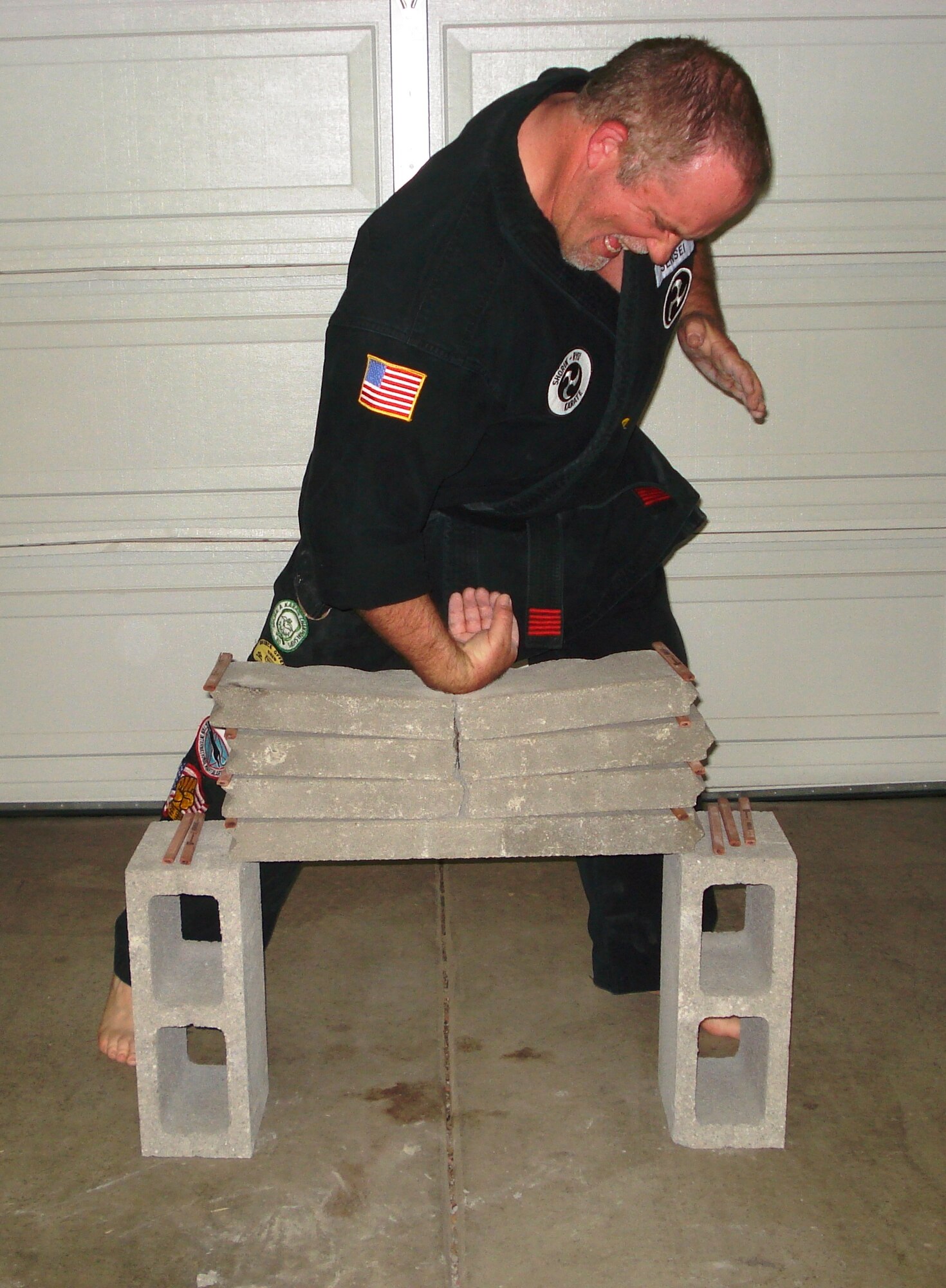 Gregory Trumbull, 60th Medical Support Squadron logistics specialist, Wrist OX Jaw strikes through 5 2-inch bricks while holding a raw egg. (Courtesy photo)
