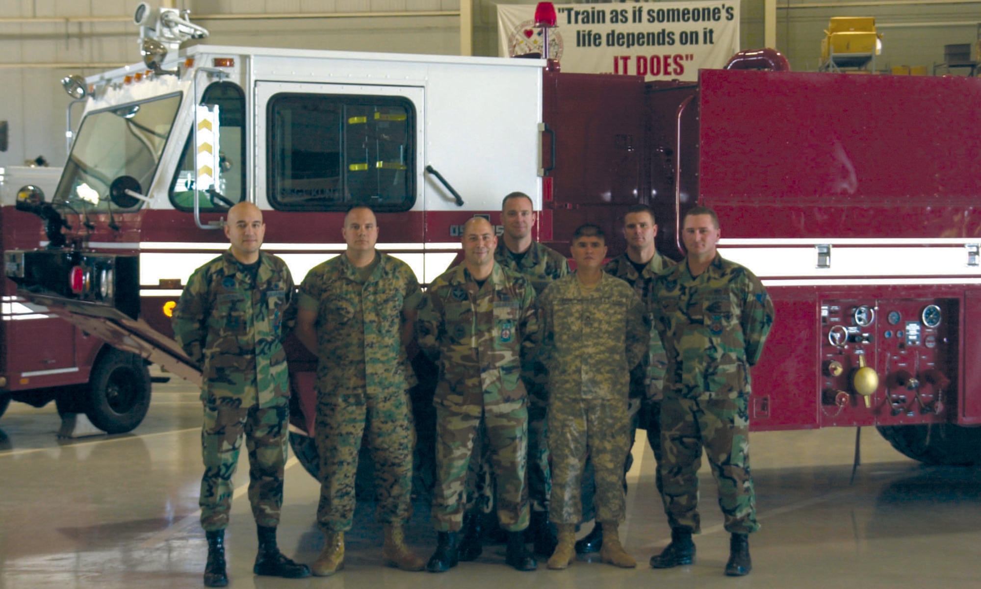 Members of Goodfellow’s Military Support for Civilian Authorities team pose in front of one of their fire trucks Wednesday at the Louis F. Garland Department of Defense Fire Academy. From left to right are Master Sgt. Al Medina, Marine Sgt. Taylor Leathers, Staff Sgt. Matt Hare, Staff Sgt. Scott Anderson, Army Staff Sgt. Luis Ruesga, Staff Sgt. Travis Winningham and Staff Sgt. Jason Cunningham, all of the 312th Training Squadron. Not pictured are Staff Sgt. Eric Kunz (the primary driver of the truck) and Navy Petty Officer 2nd Class Victor Torres. (U.S. Air Force photo by Airman 1st Class Stephen Musal)